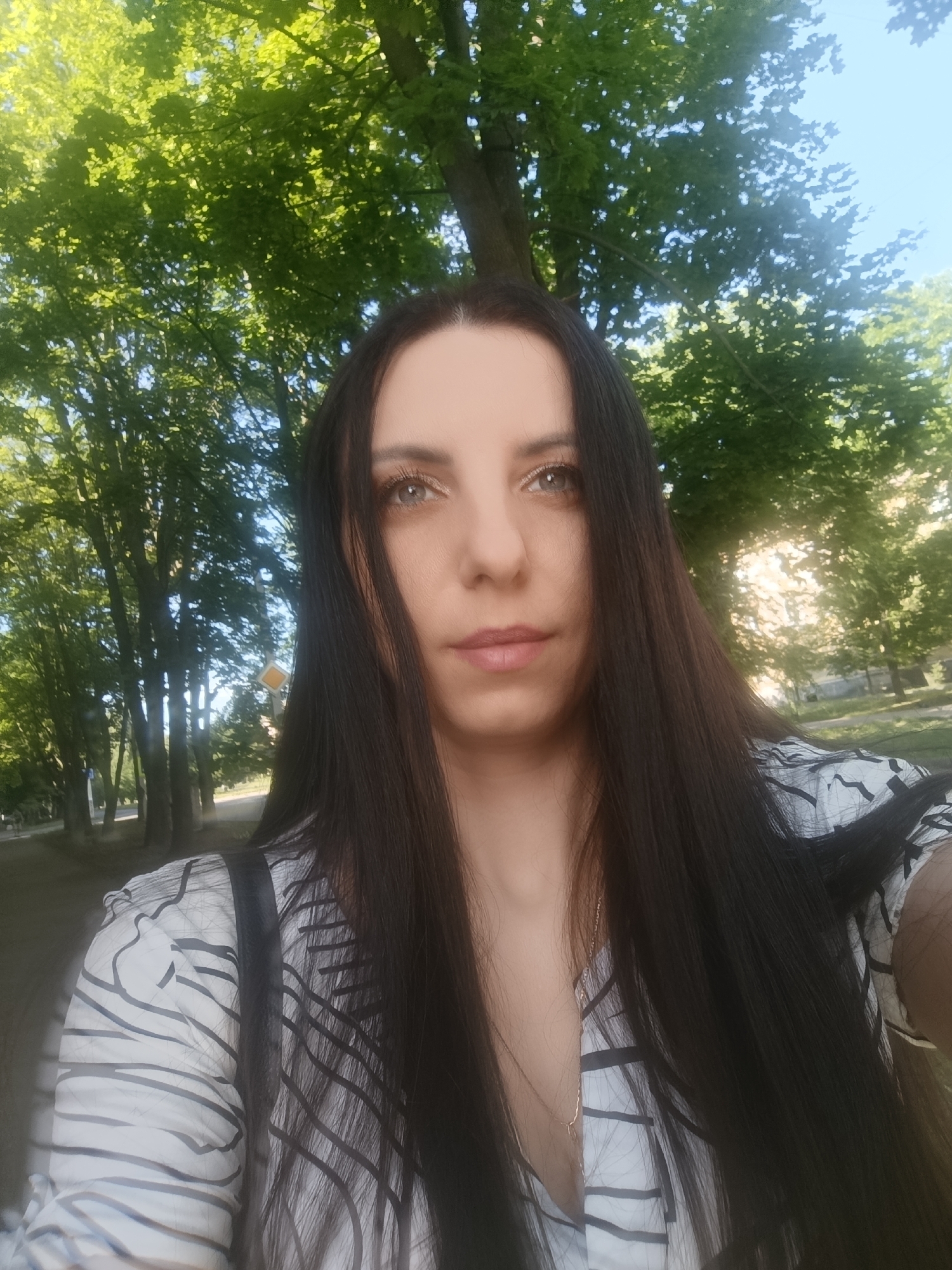 Multiple angles of outdoor park selfies in quick succession