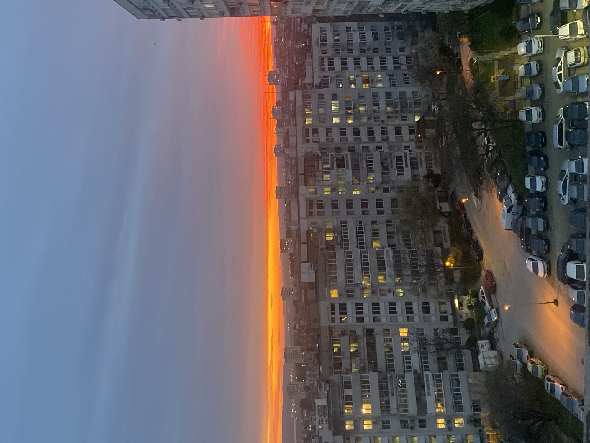 Sunset aerial view captured over Varna neighborhood from high-rise