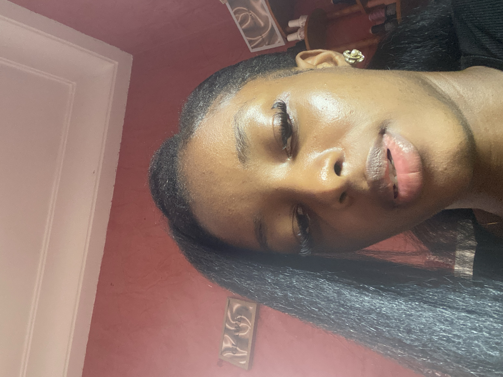 Woman takes selfies indoors in Jos, Nigeria