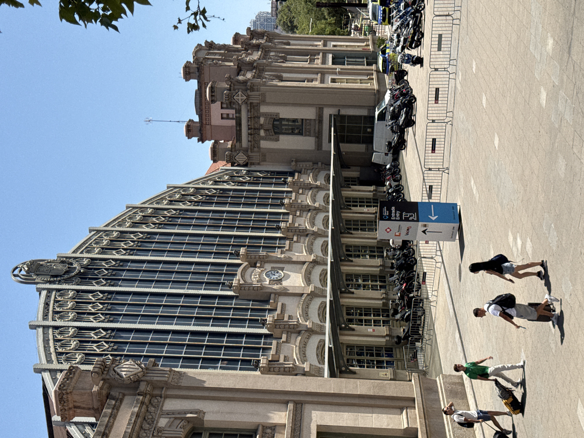 Sunny day outside a grand ornate building in Barcelona