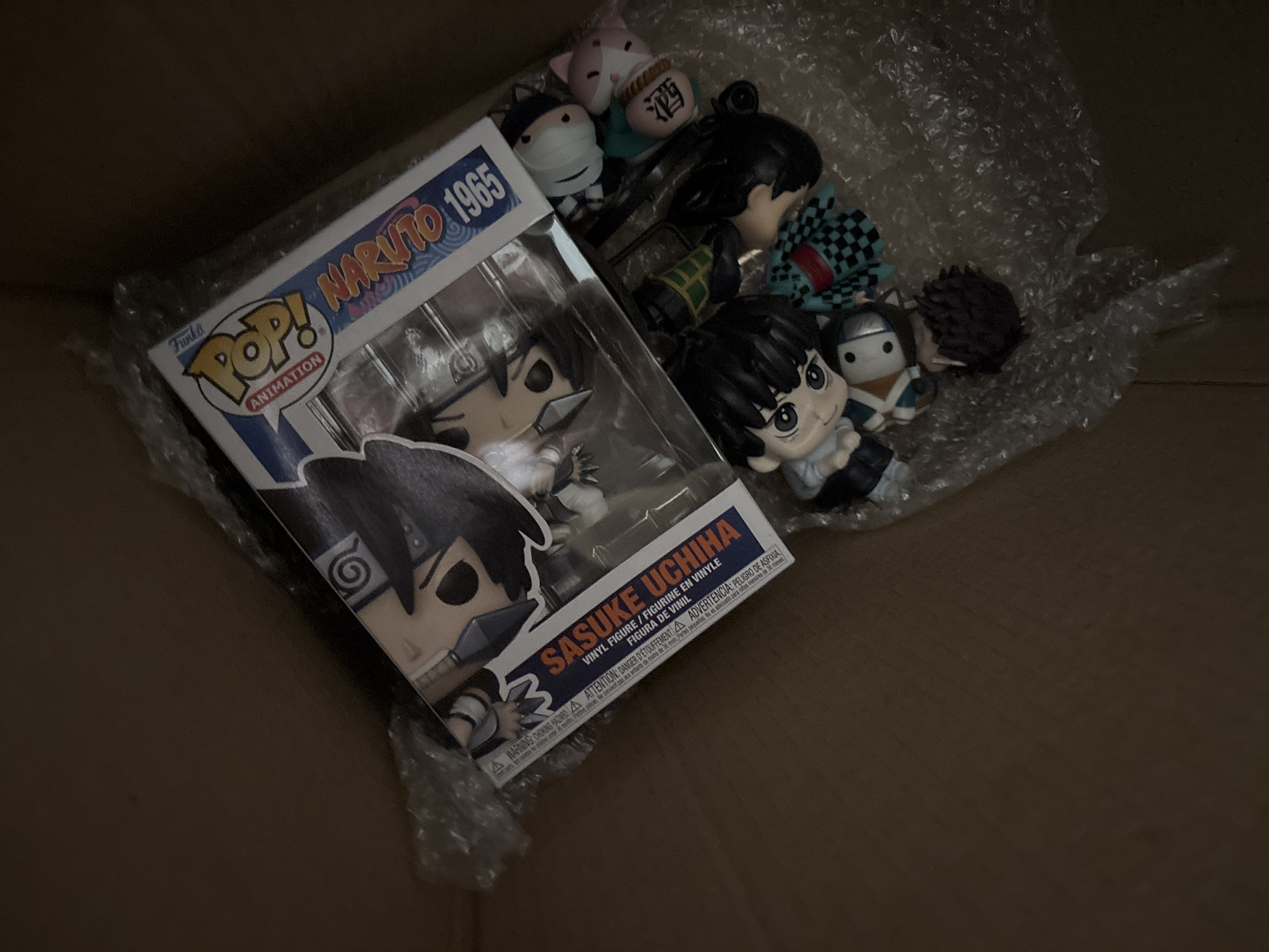 Anime collector receives shipment of Naruto merchandise and figures