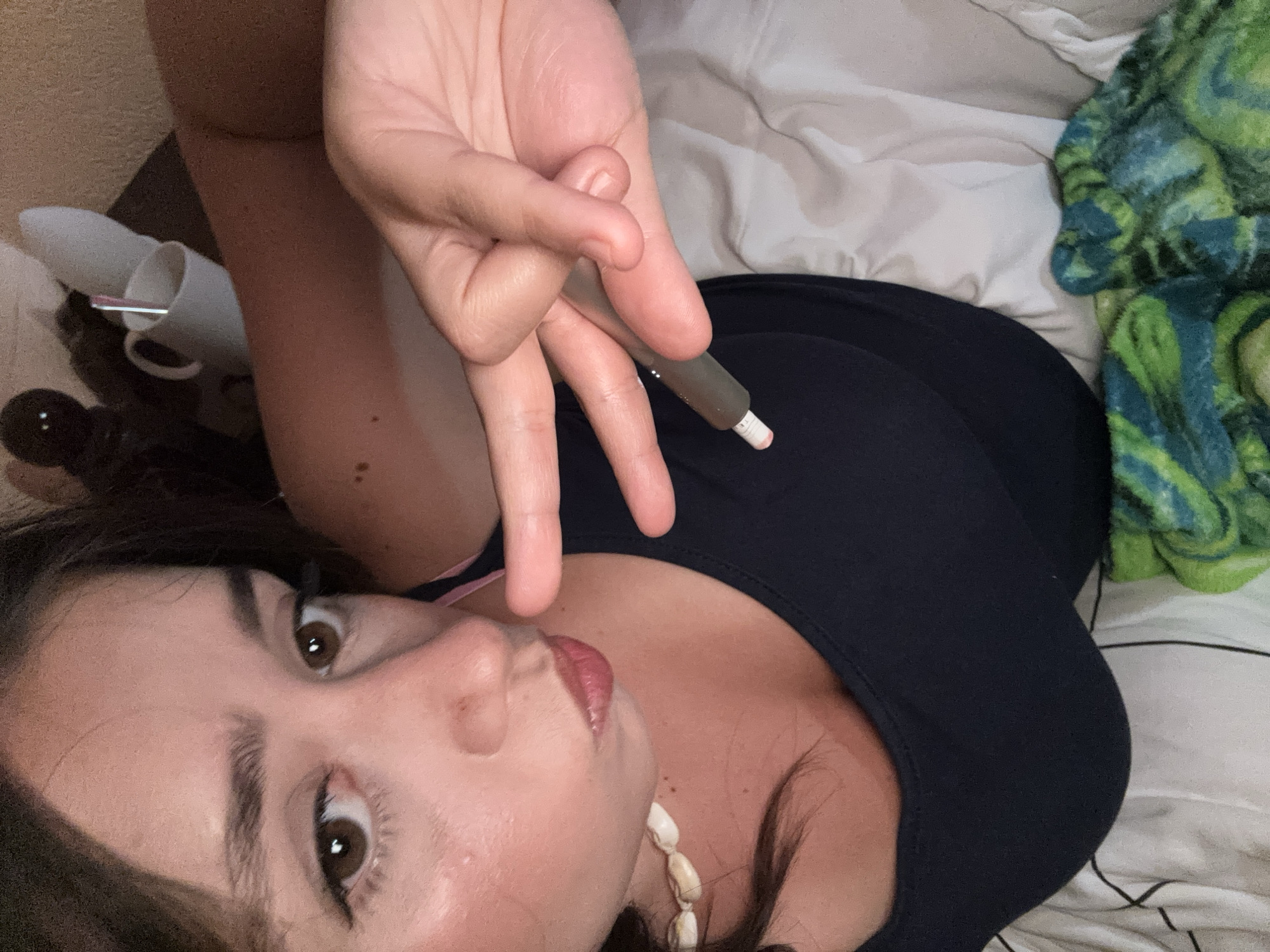 Chilling indoors in Garmen, vape in hand, TV on