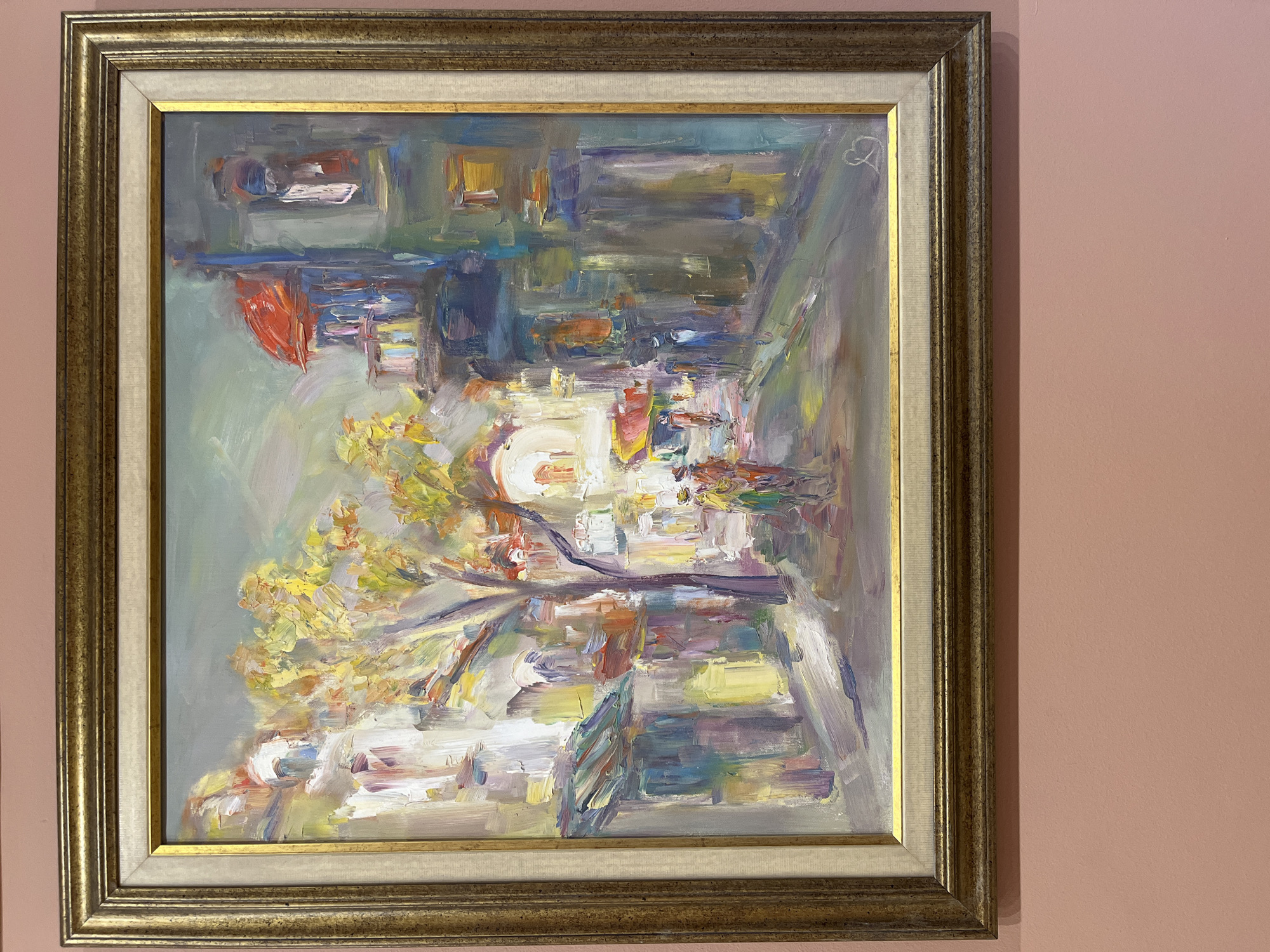 Oil paintings displayed on pink walls in Plovdiv