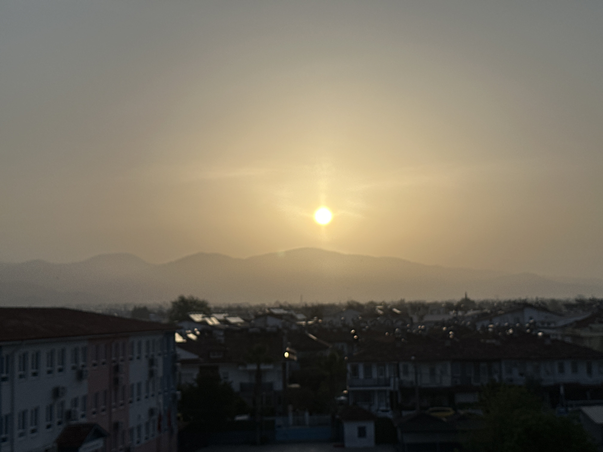 Sunset captured over residential Fethiye, Turkey cityscape