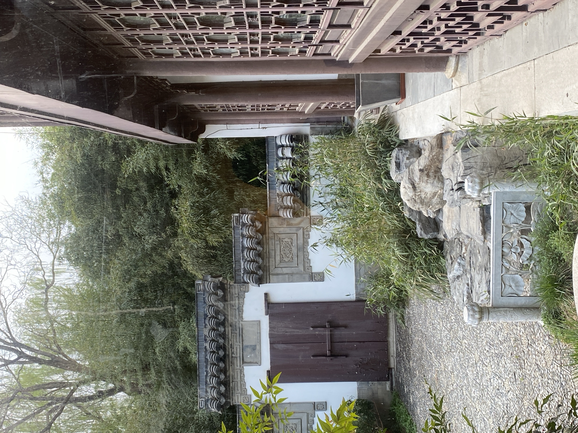 Traditional Chinese garden visit features cats, waterfalls, art displays