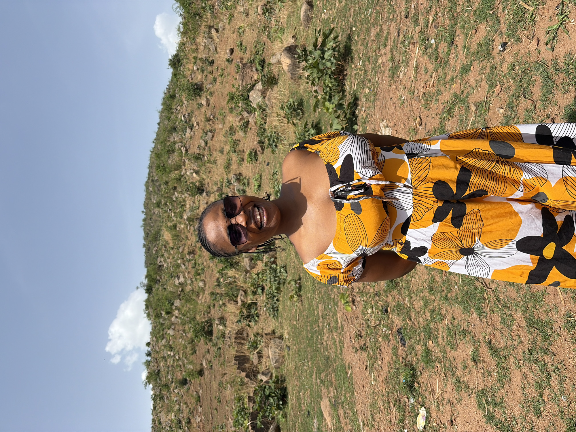 Woman poses for outdoor portrait session in Jos hills