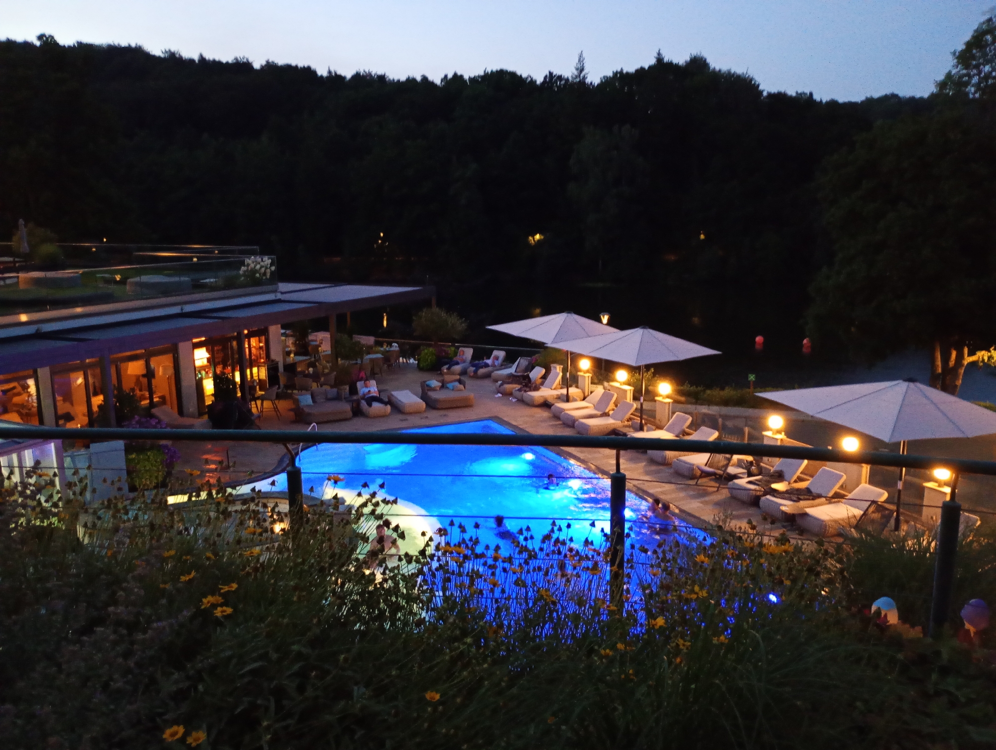 Hotel courtyard glows at dusk in Bad Sachsa, Germany