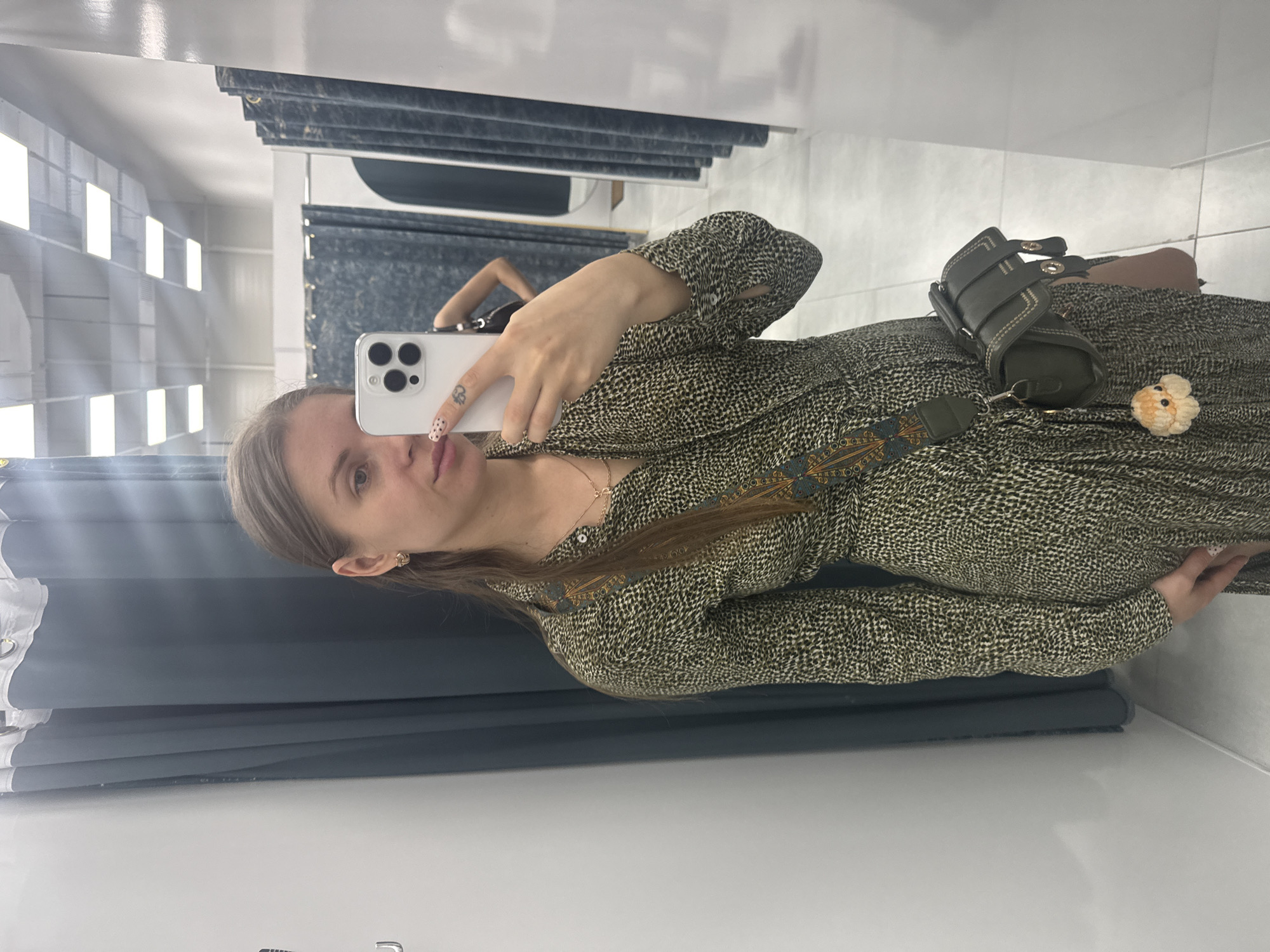 Woman takes selfies while trying on clothes in Batumi