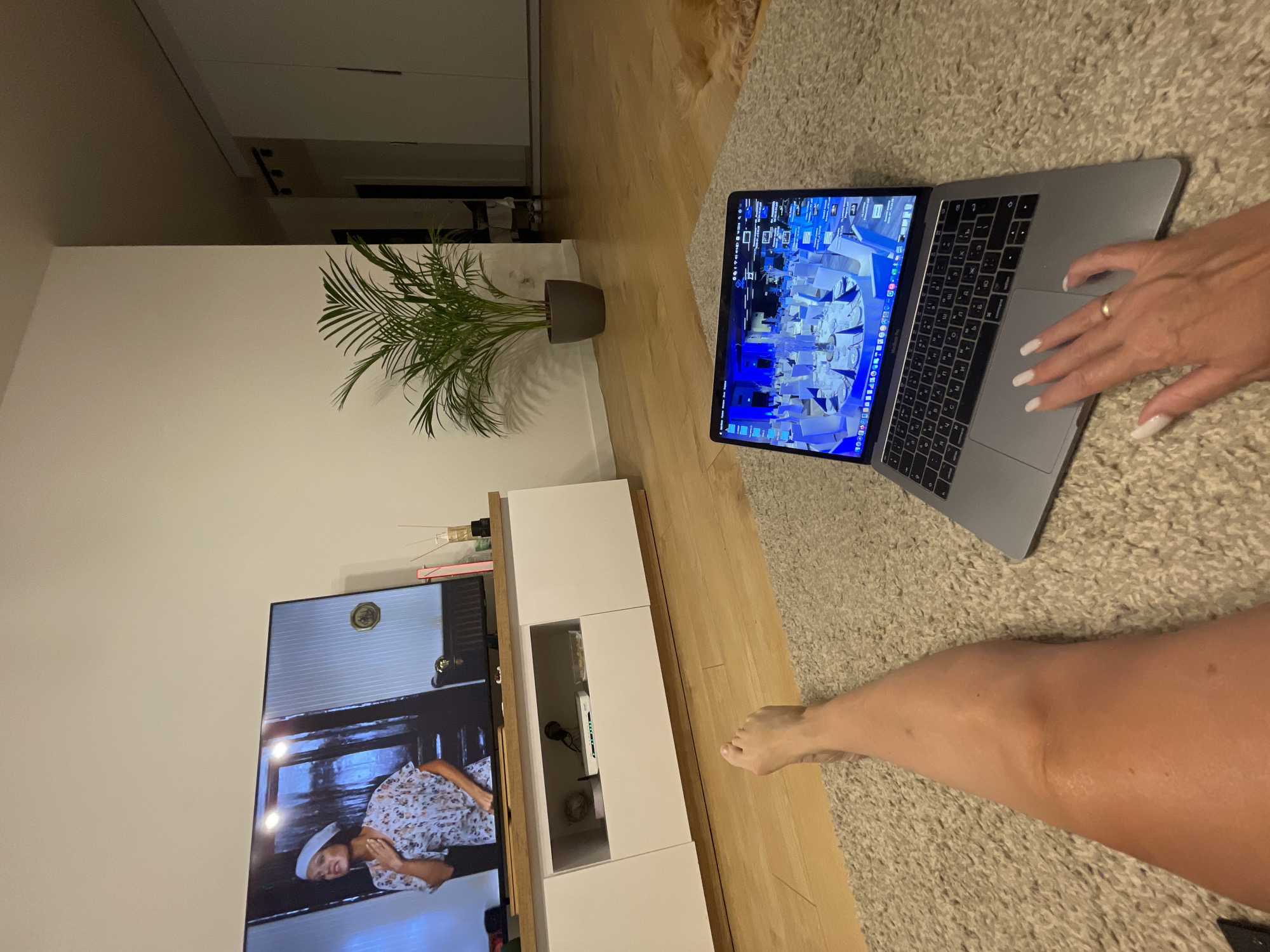 Cozy home evening in Wrocław with a dog, candles, and a virtual event
