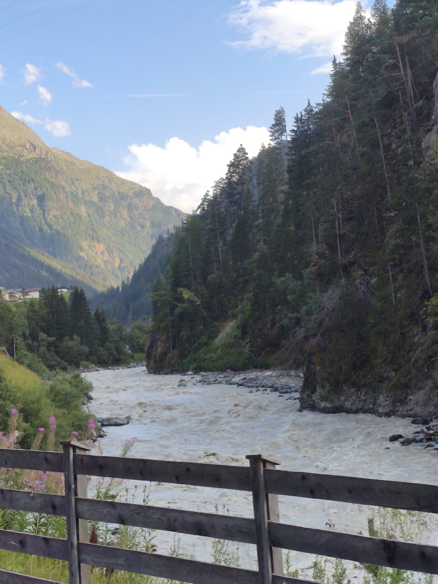 Muddy alpine river running strong through Oetz Valley, Austria