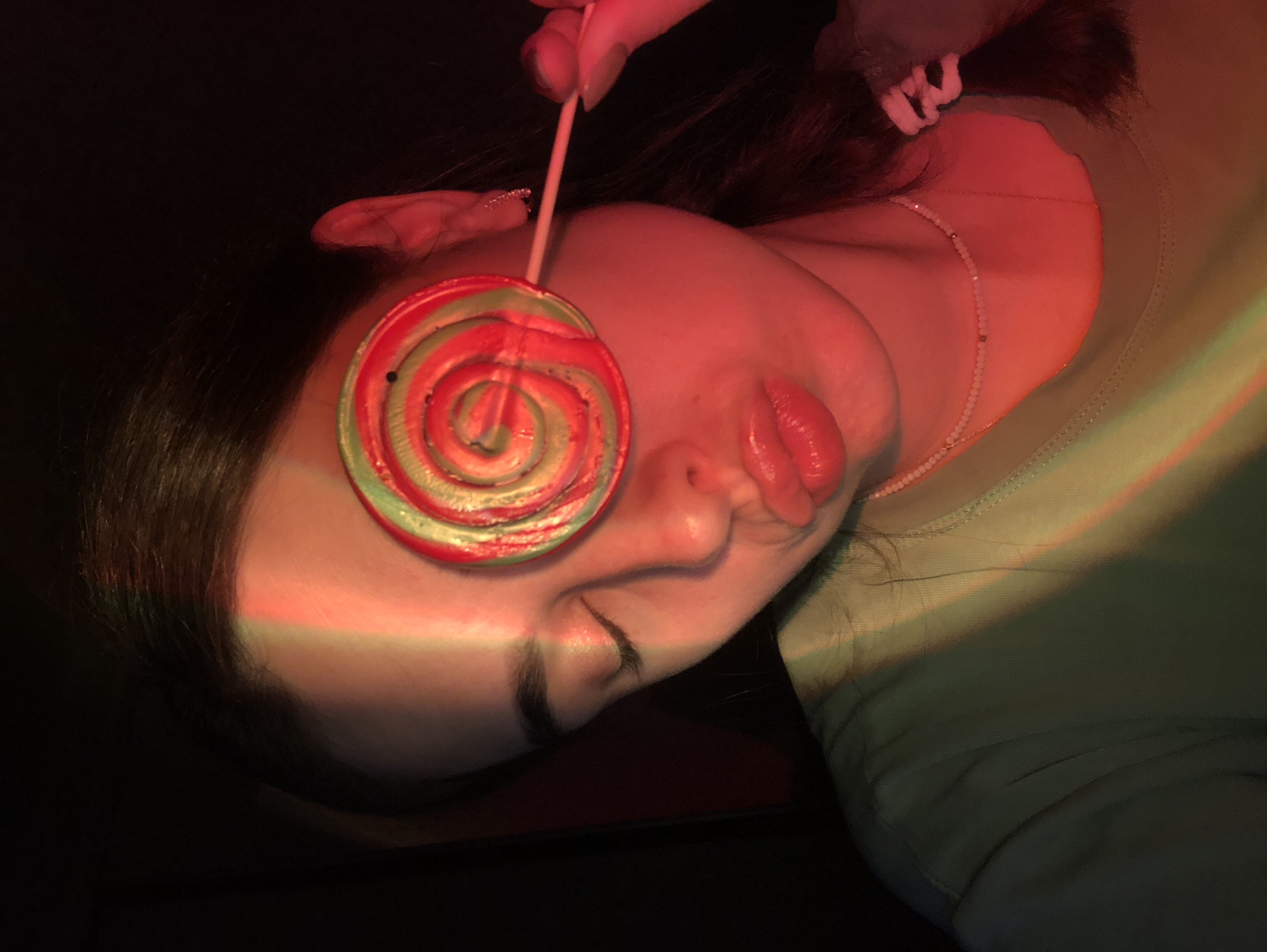 Elf ears and neon face paint under blacklight in Noviy
