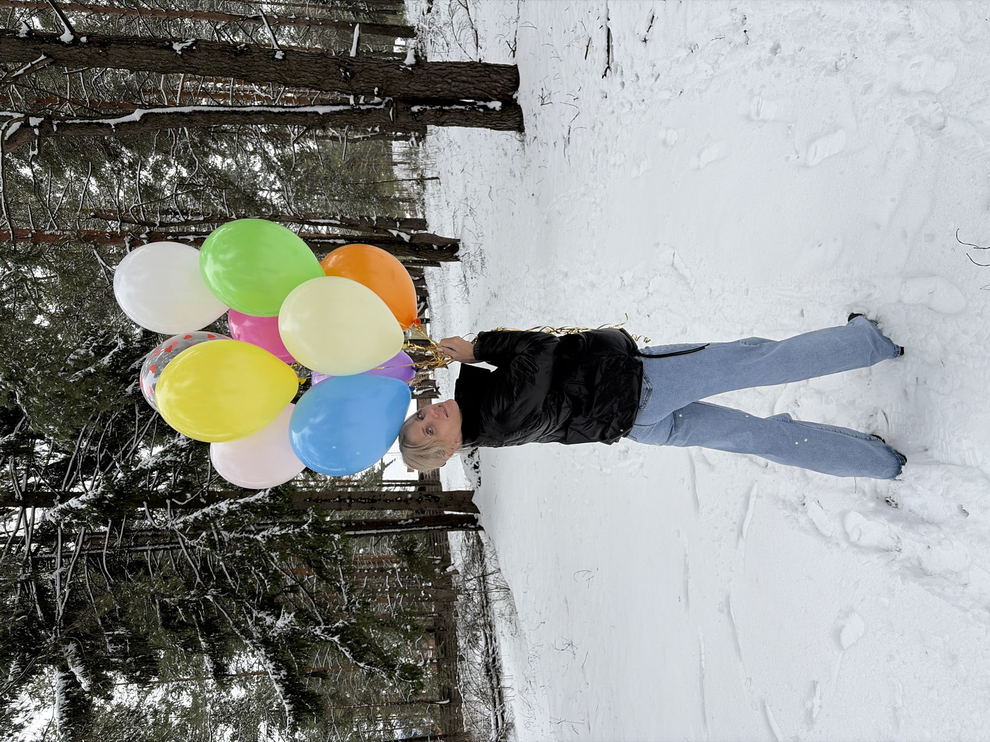 Woman with balloons spotted in snowy Russian woodland