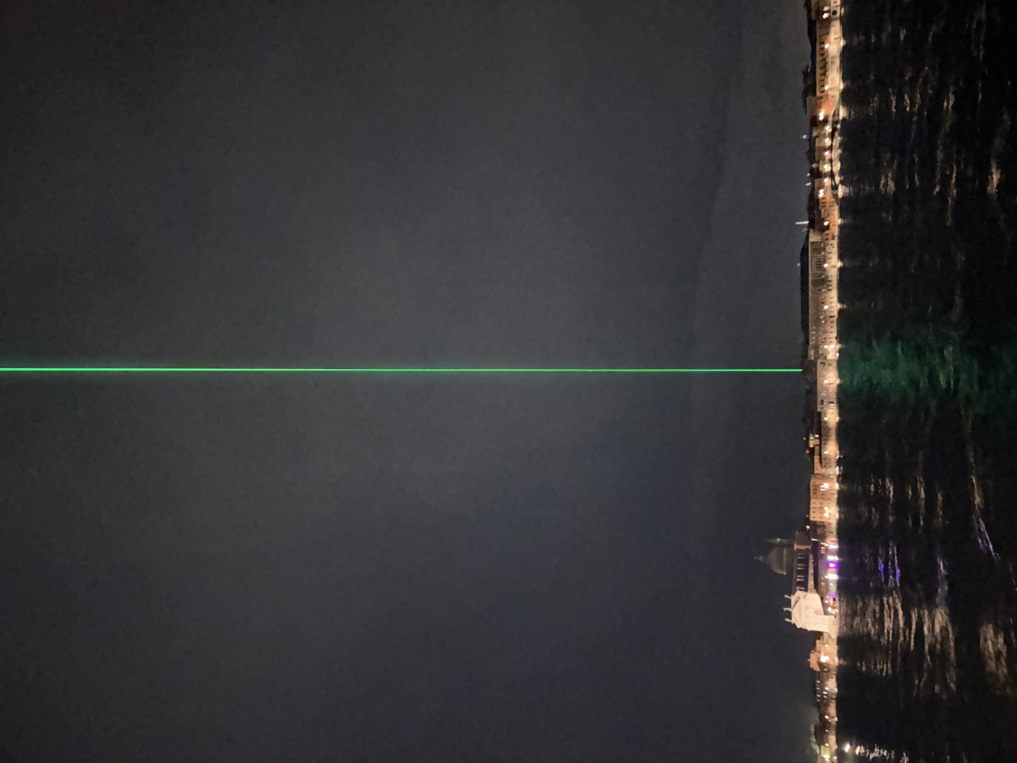 Green laser beam spotted across Venice night sky