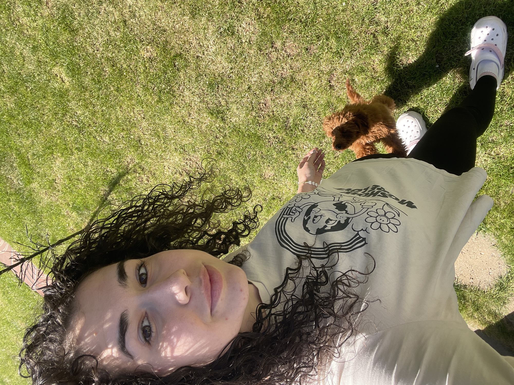 Woman and puppy enjoy sunny afternoon in Sofia garden