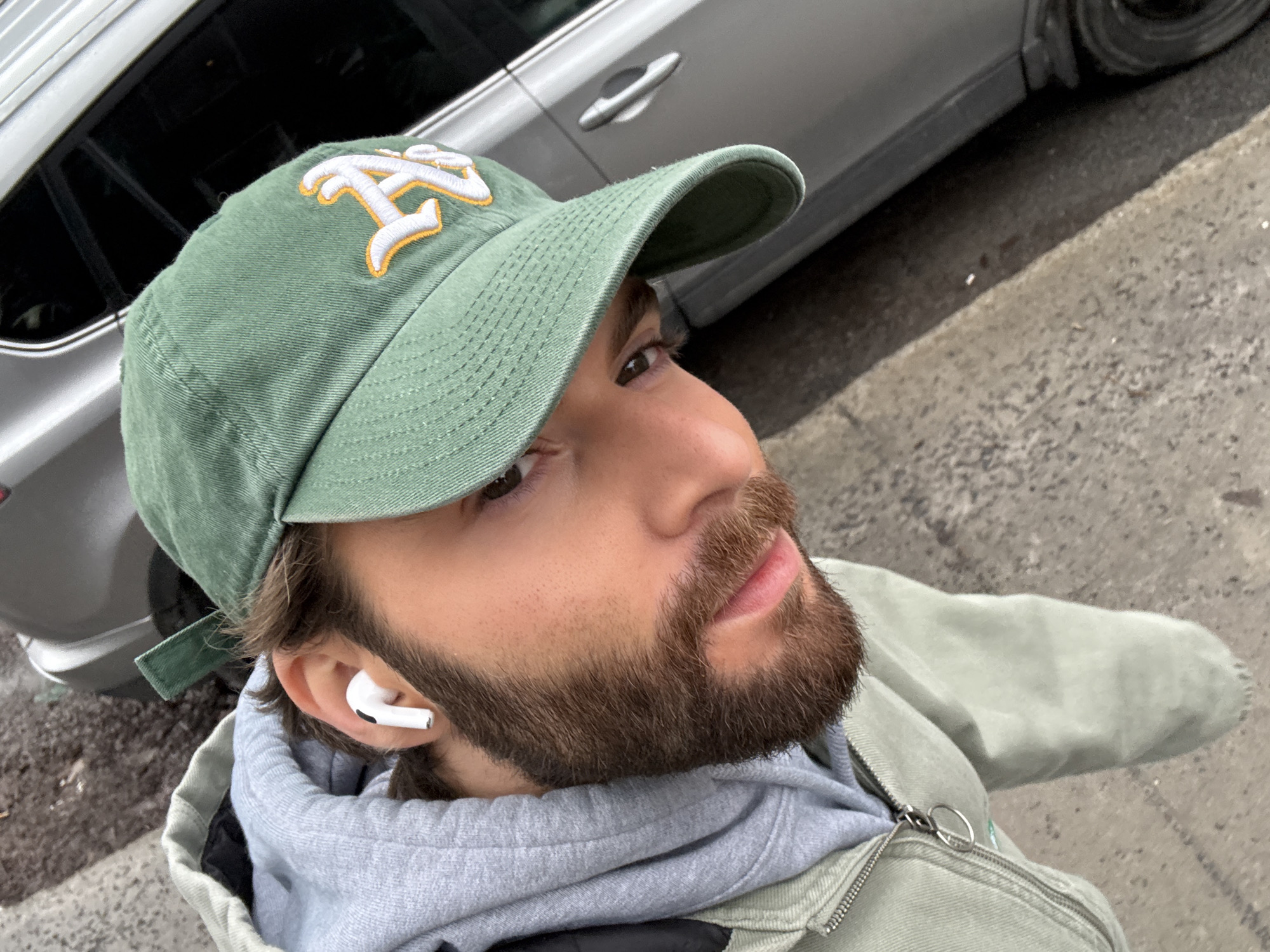 Man Takes Selfie in Green Cap in Montreal
