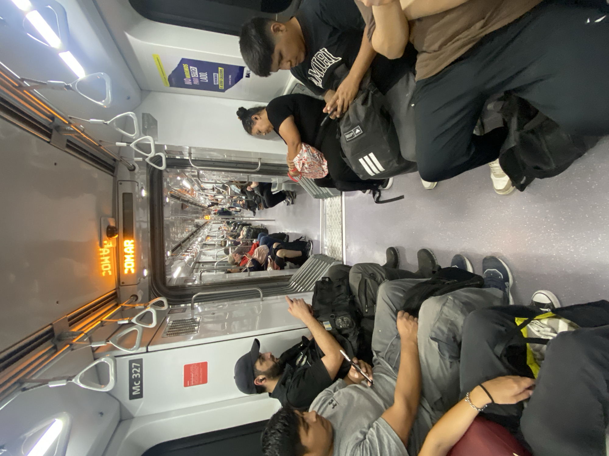 Crowded commuter train documented in Buenos Aires evening rush