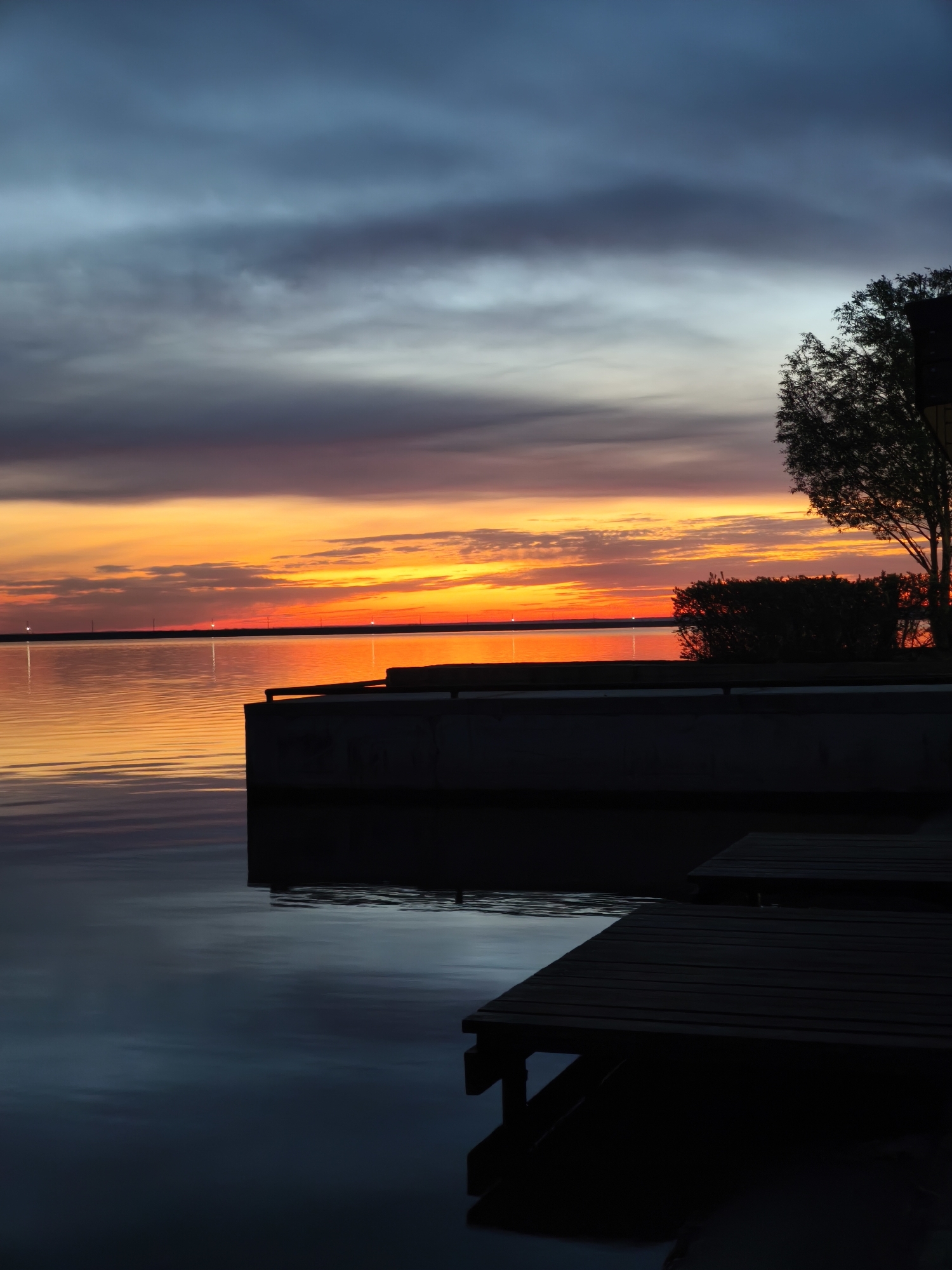 Sunset waterfront scene documented in Chaikovsky, Russia