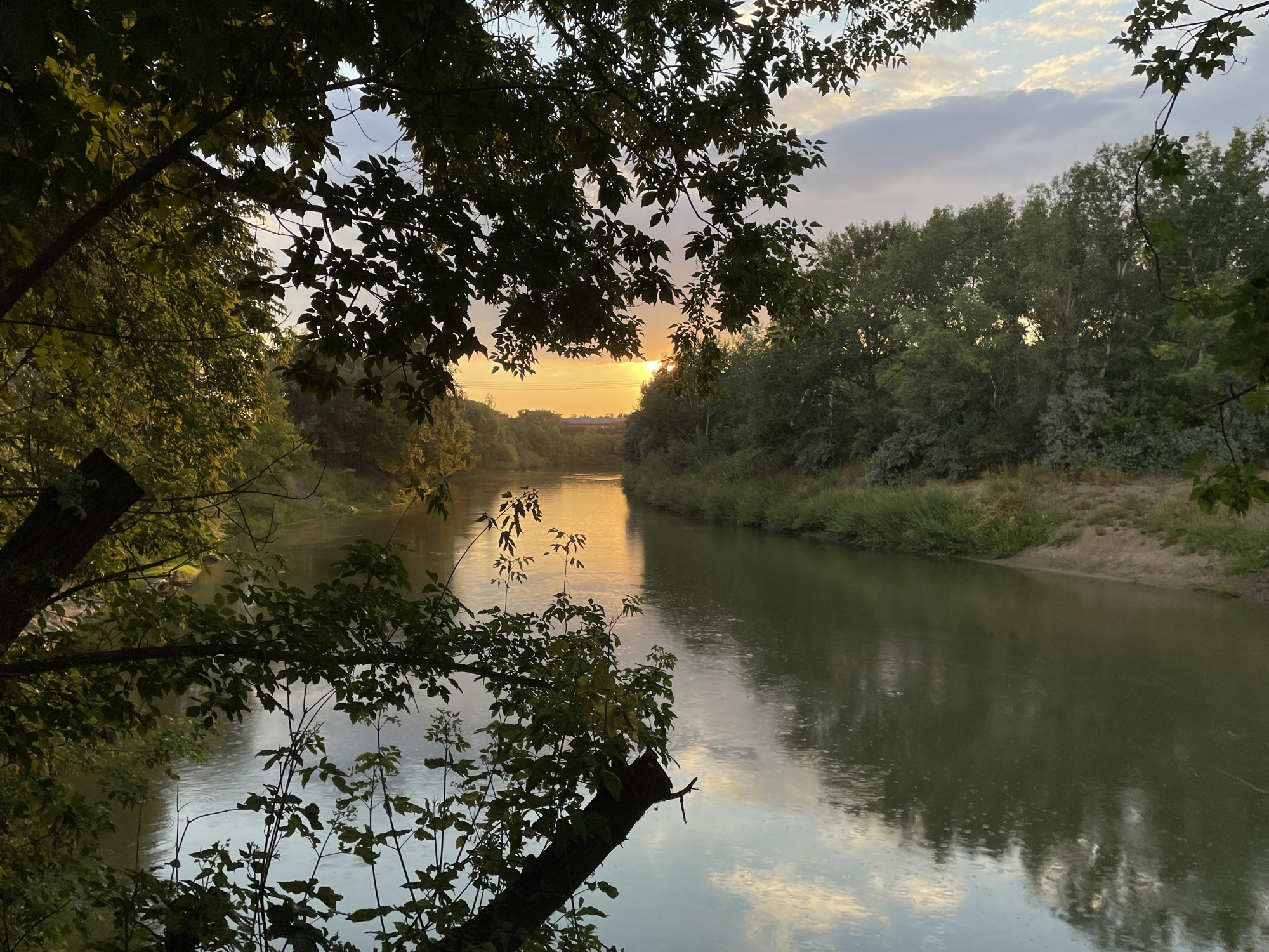Golden dusk light over a quiet river, two angles