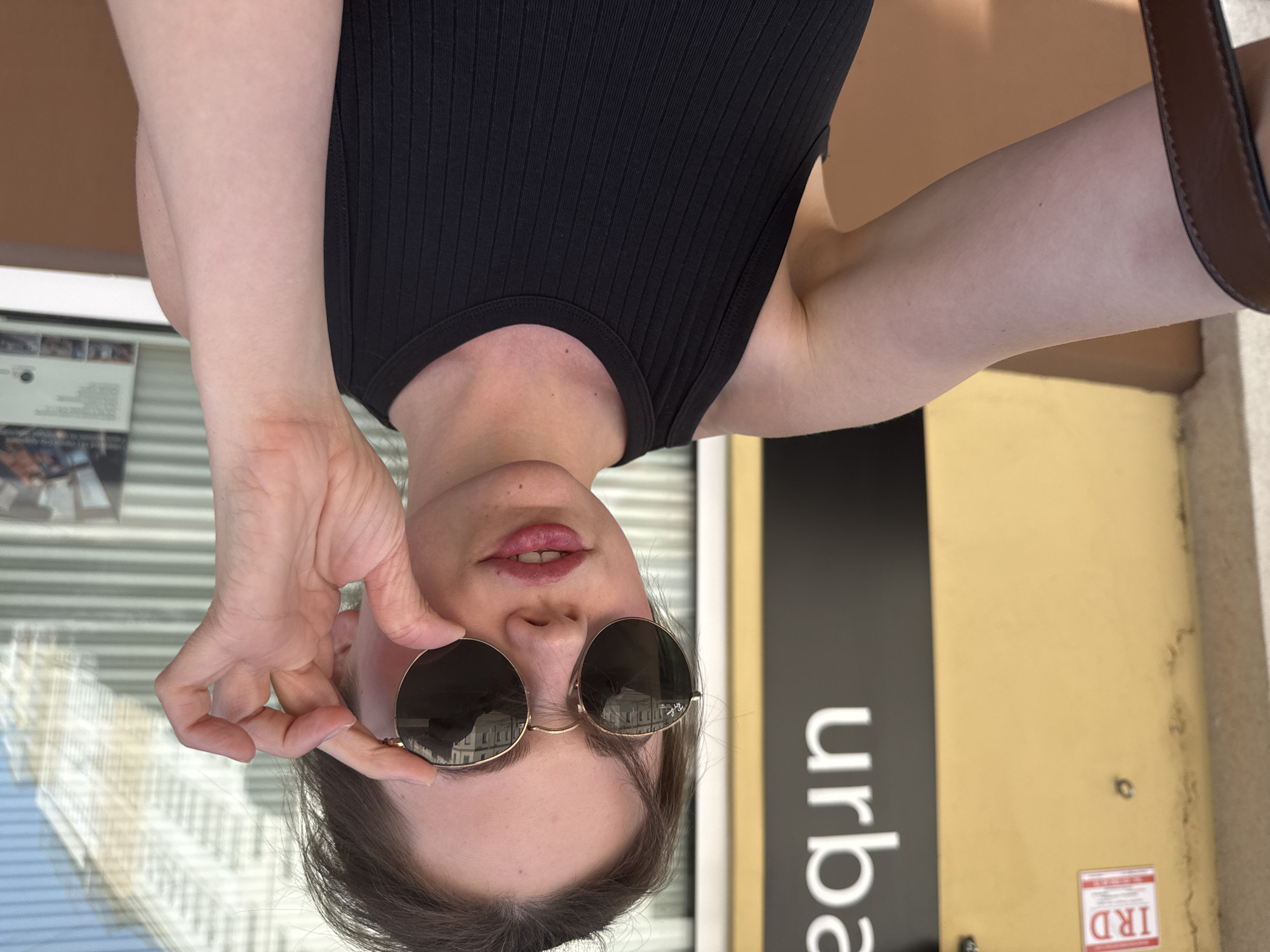 Woman takes selfies in Vienna during afternoon photo session