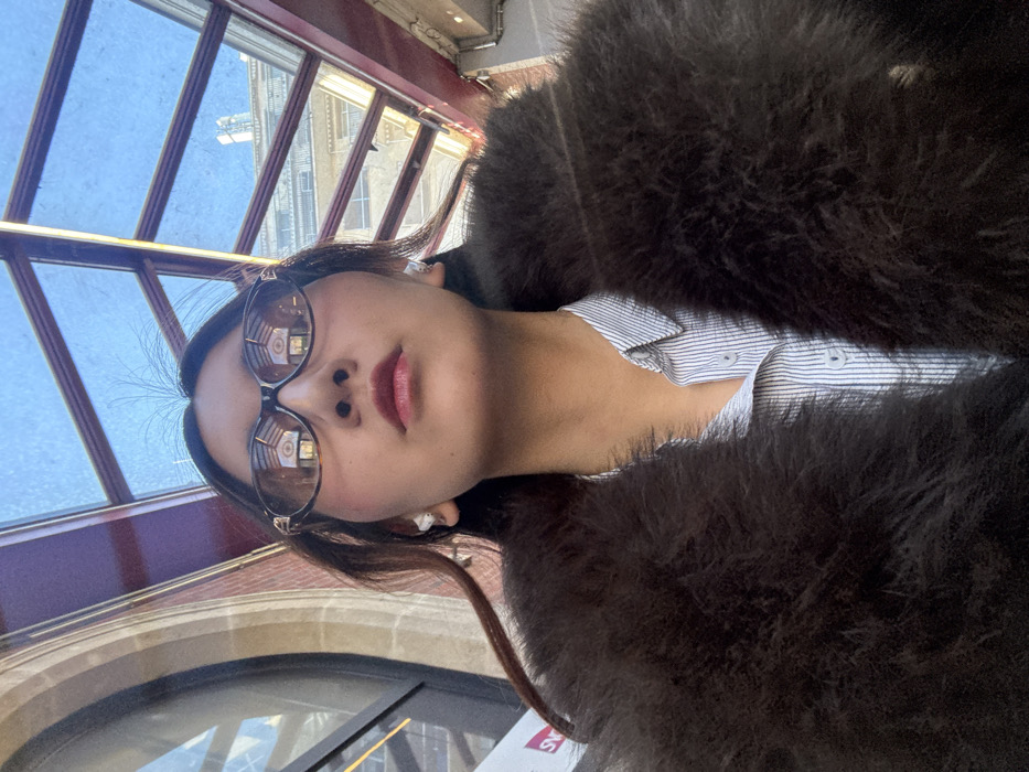 Woman takes selfies on Paris street