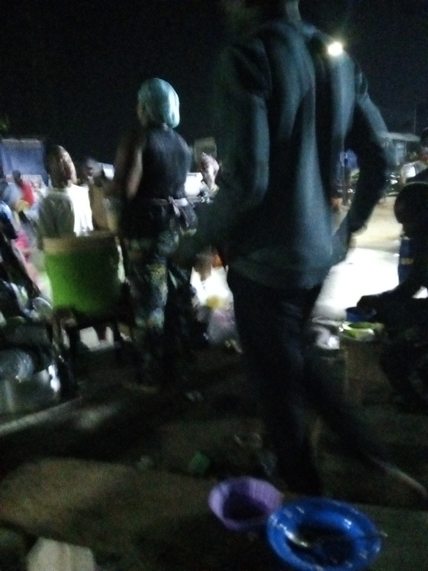 Evening street life unfolds in Ado, Nigeria commercial district