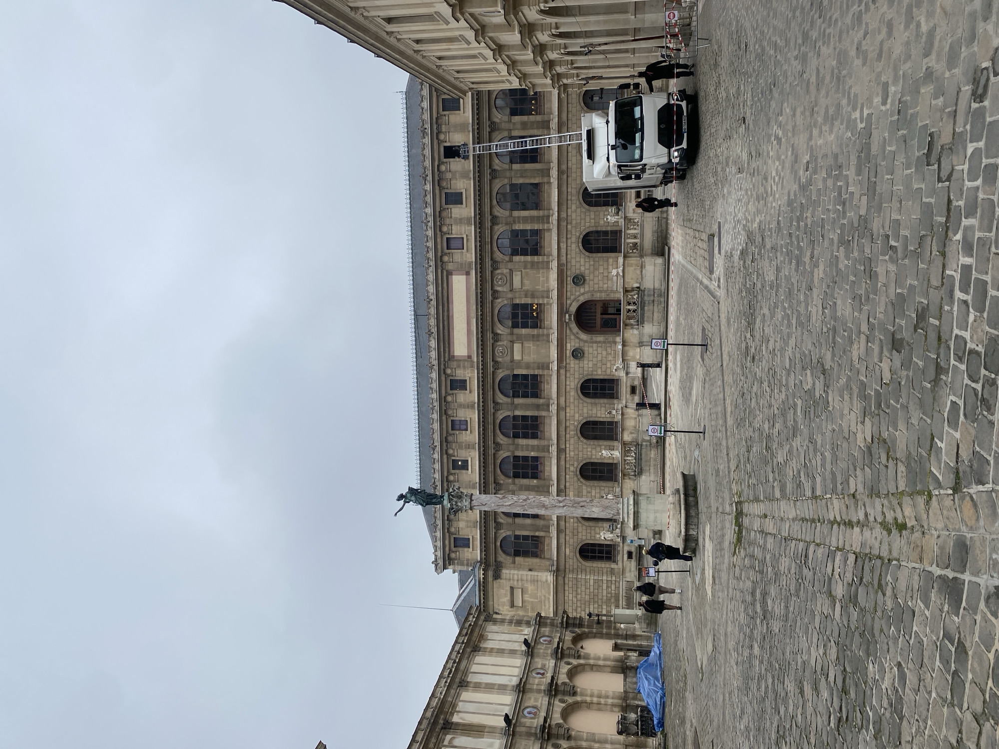 Classical Parisian architecture with statue column documented