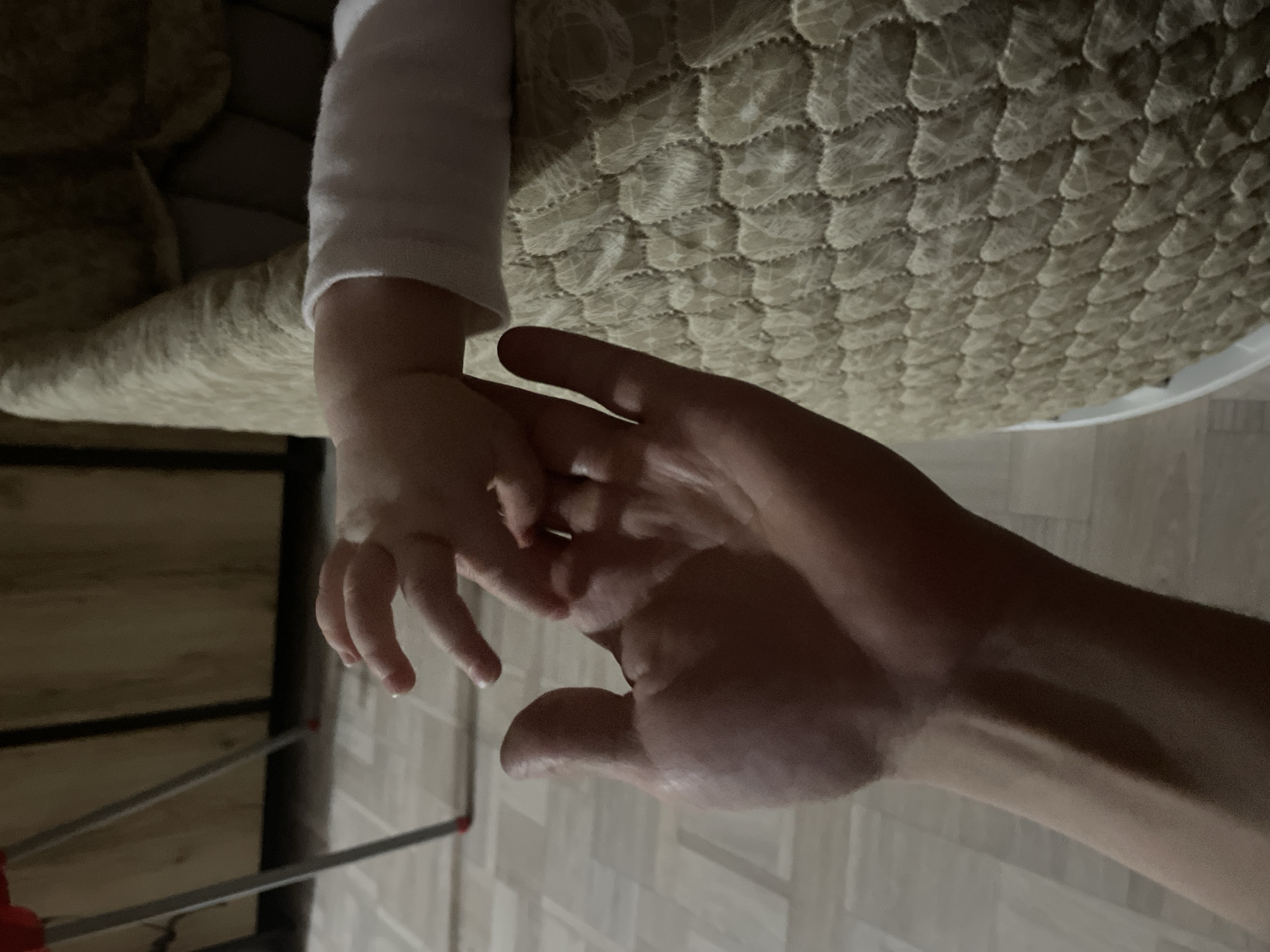 Evening domestic moments: baby in crib, noodle cooking