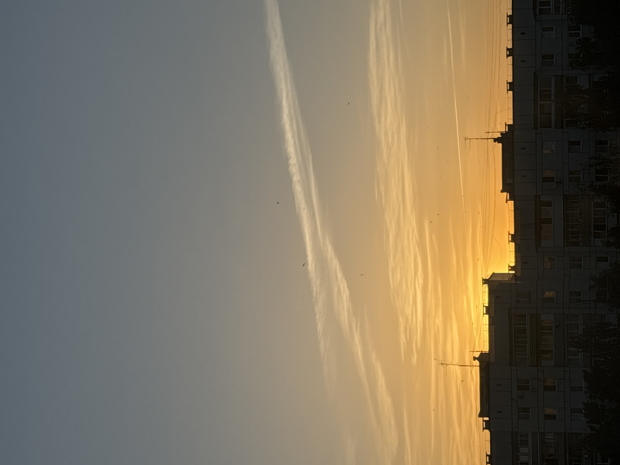 Urban sunset documented by witnesses across city district