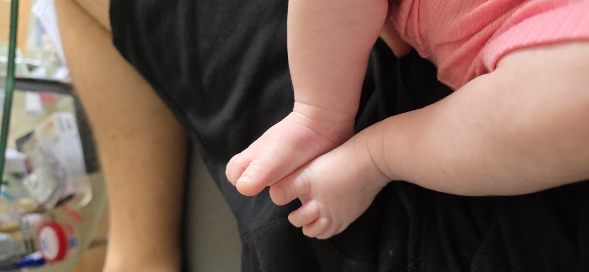 Tender moment captured between adult and baby in Munich home