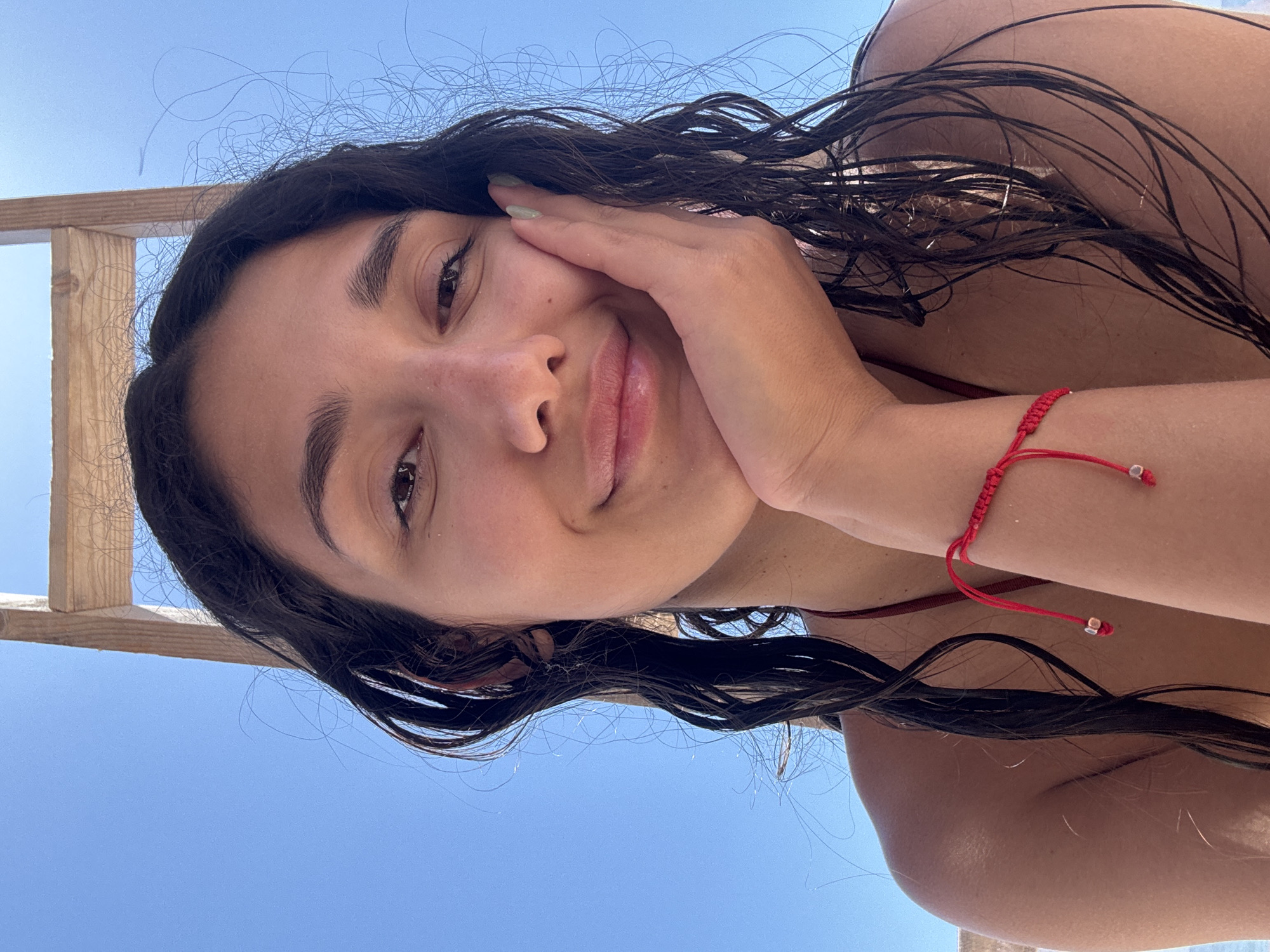 Woman takes selfie with wet hair in Vrba, Montenegro