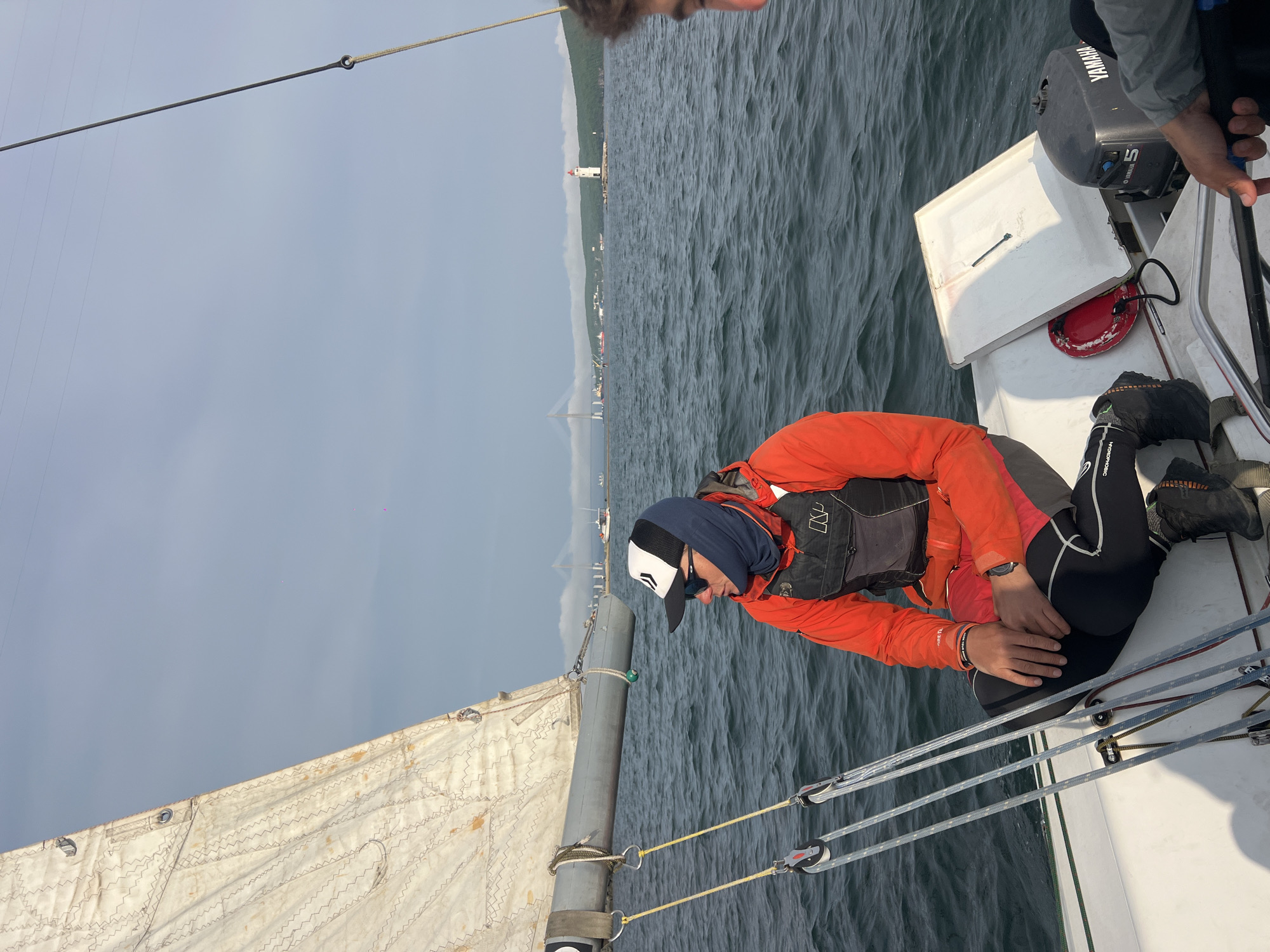 Sailing crew enjoys choppy waters near Vladivostok under overcast skies