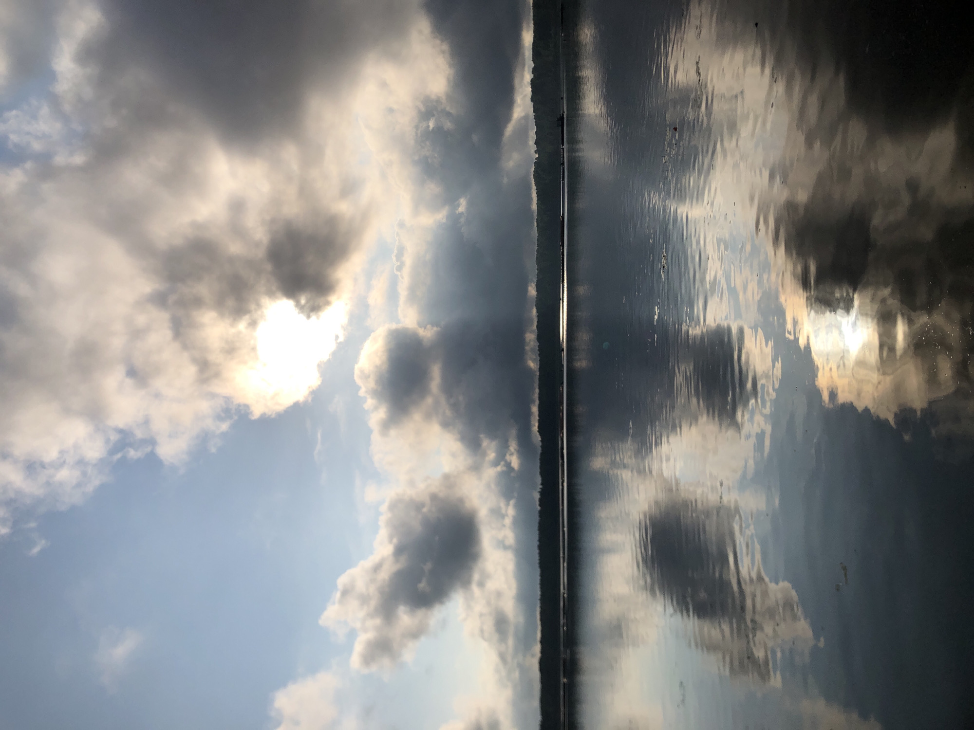 Overcast skies reflected across calm Russian waterways