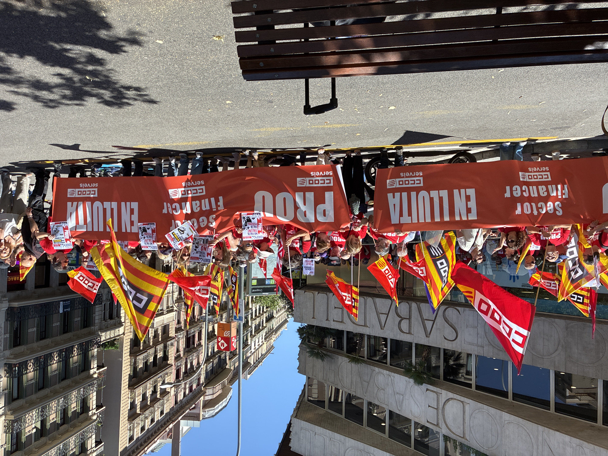 Street protest with red-shirted demonstrators unfolds in Barcelona