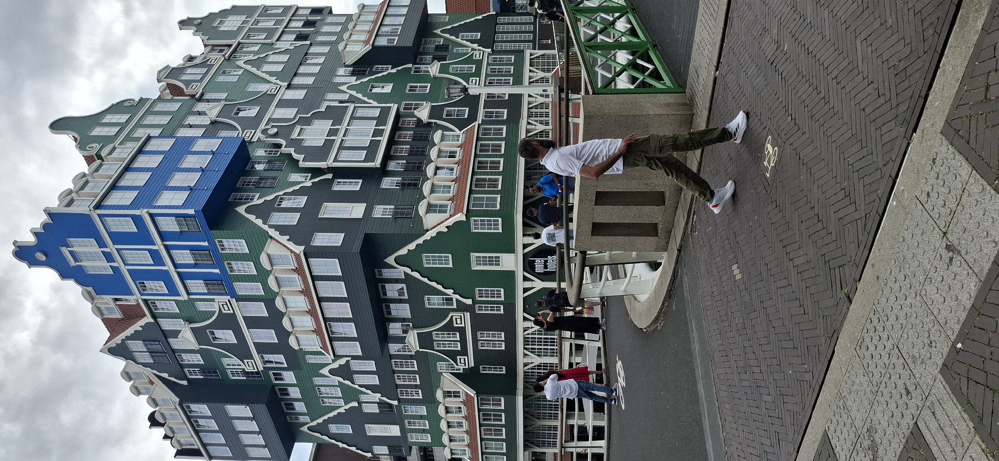 Crossing the bridge past Zaandam's iconic stacked-houses hotel