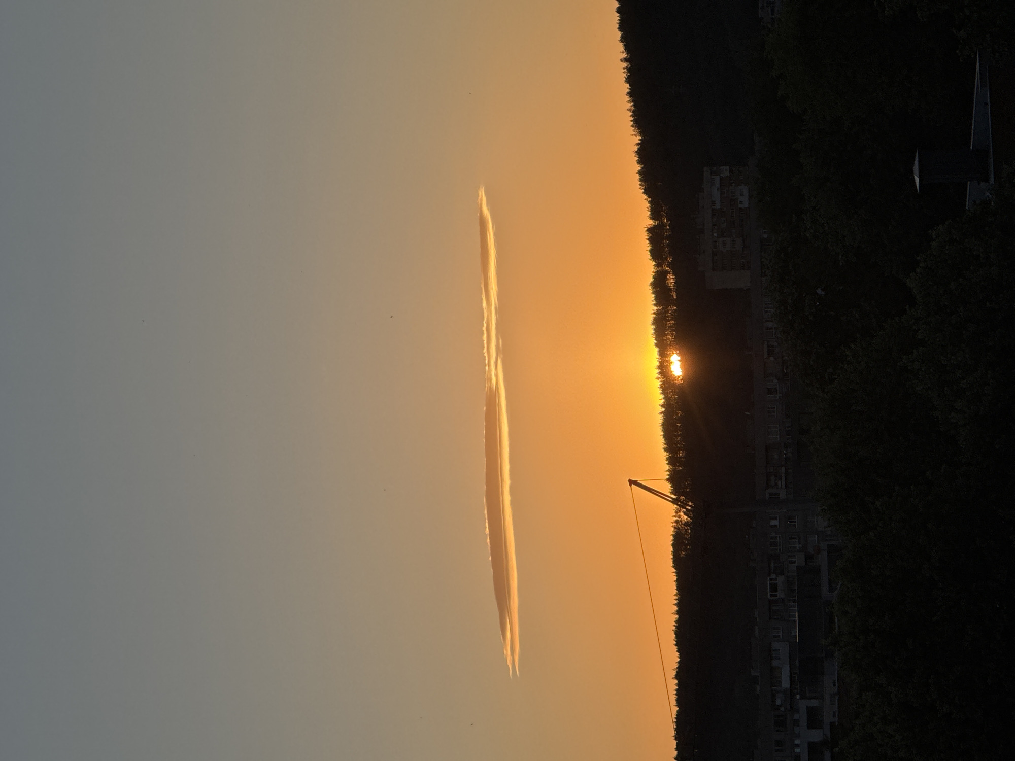 Sunset over Pernik's hills, clouds and warm light on full display