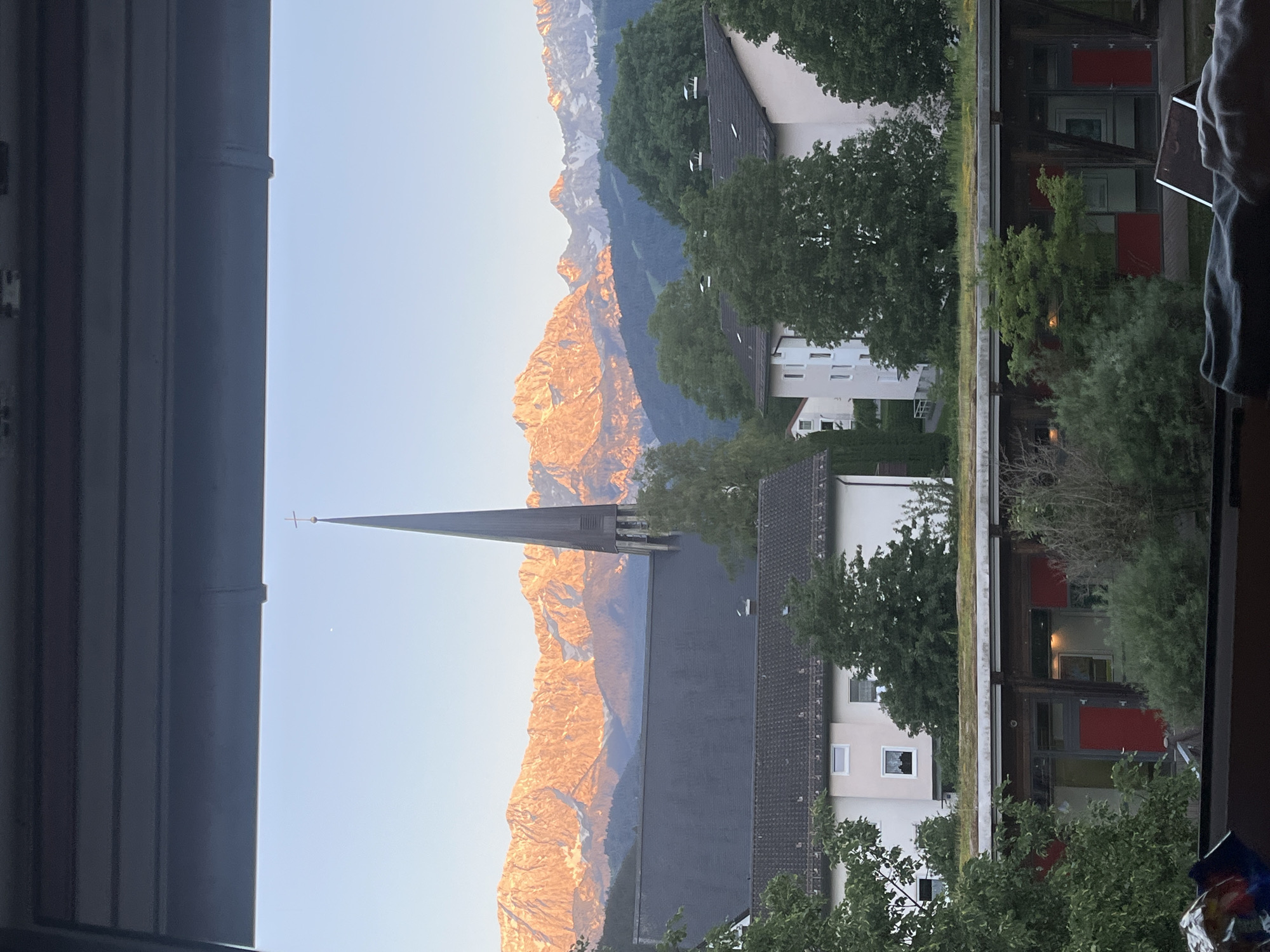 Window views captured of Garmisch-Partenkirchen church and mountains