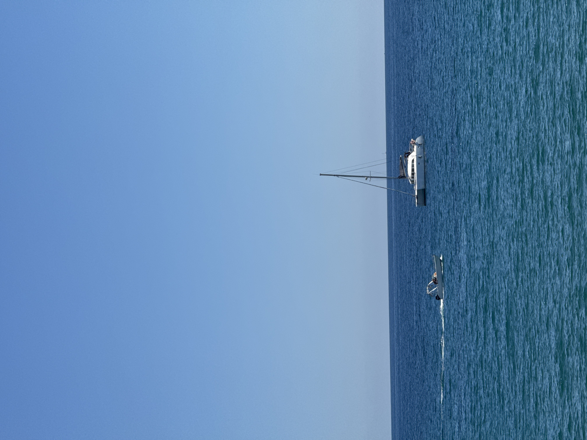 Sailboats spotted on Mediterranean near Badalona under clear skies