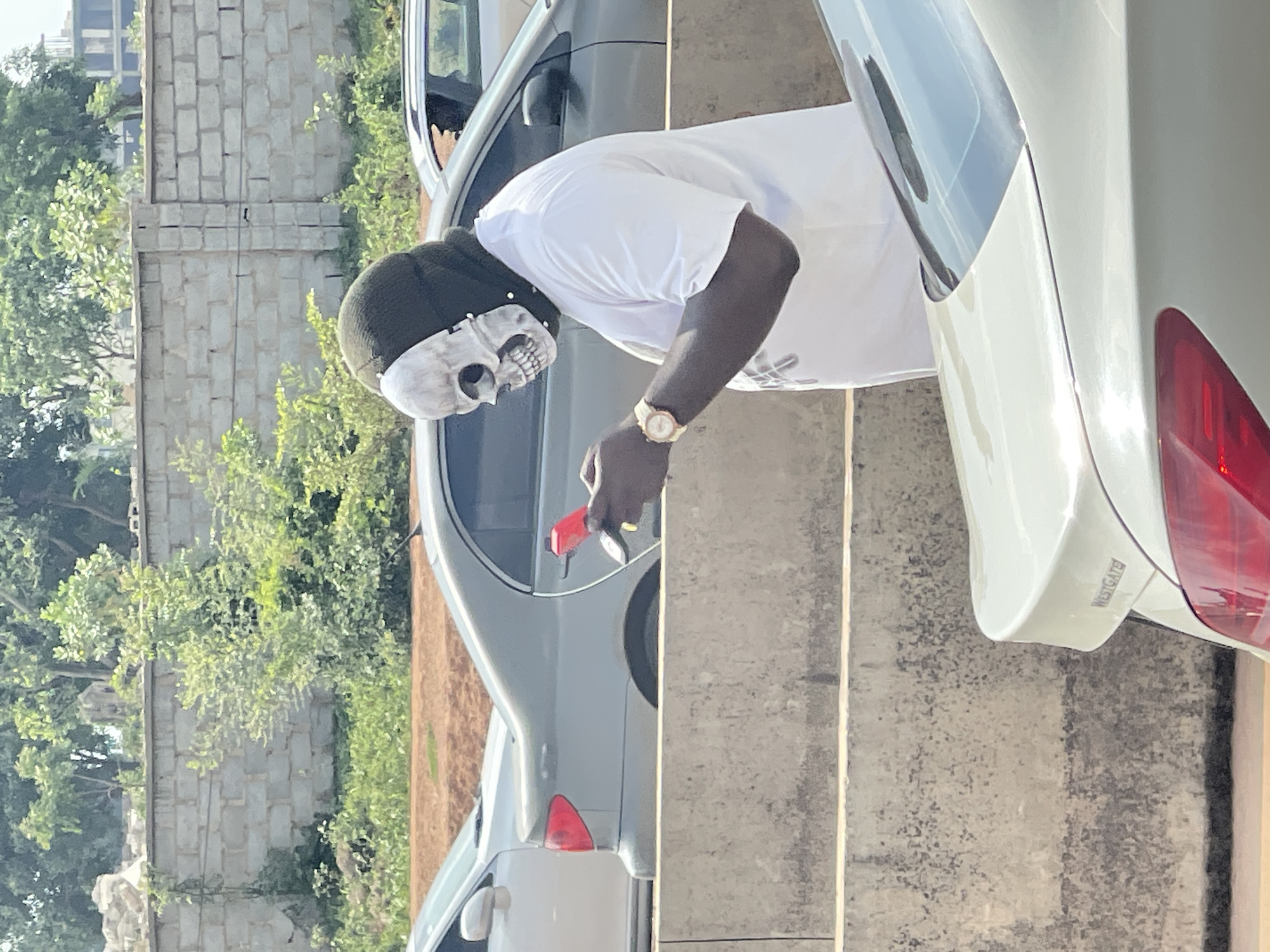 Crowd gathers along Abuja highway near national stadium