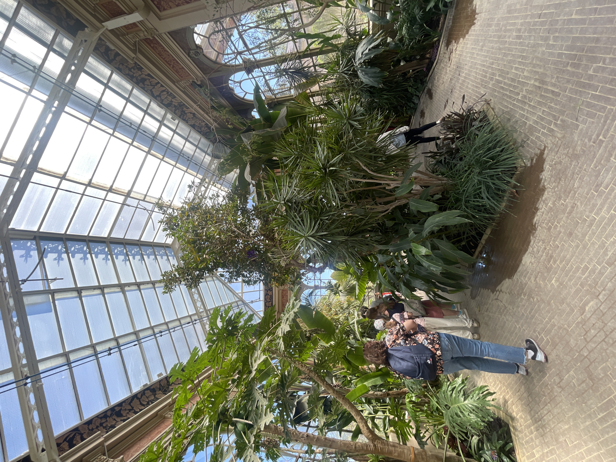 Visitors tour botanical greenhouse exhibits in Barcelona
