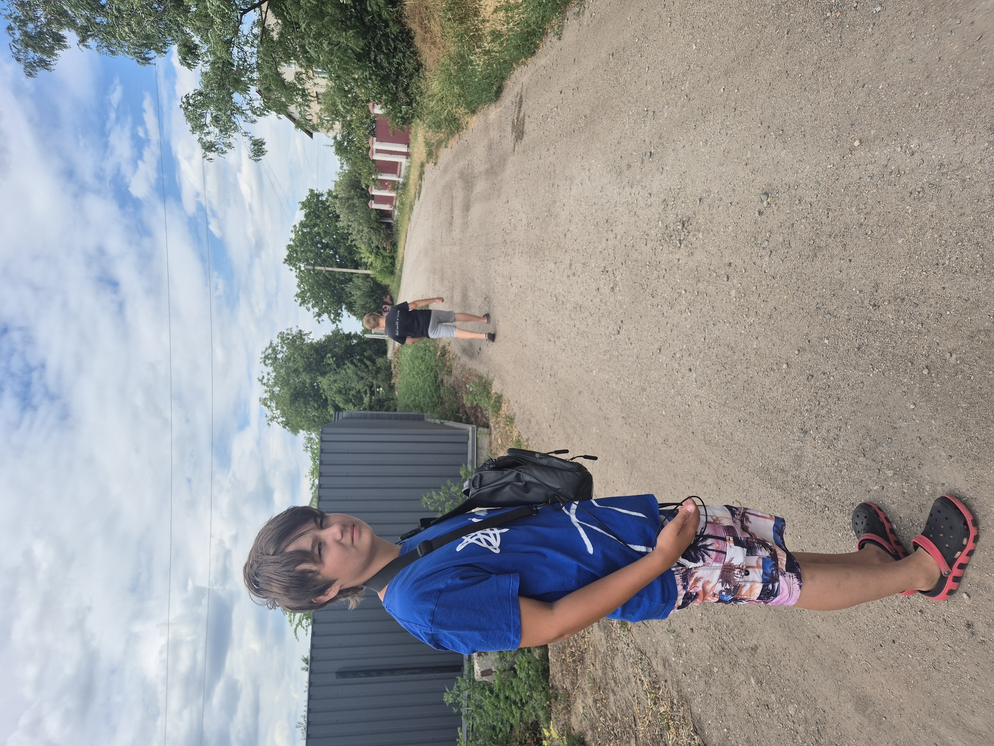 Rural life in Sozonivka: gardens, gravel roads, and parked cars