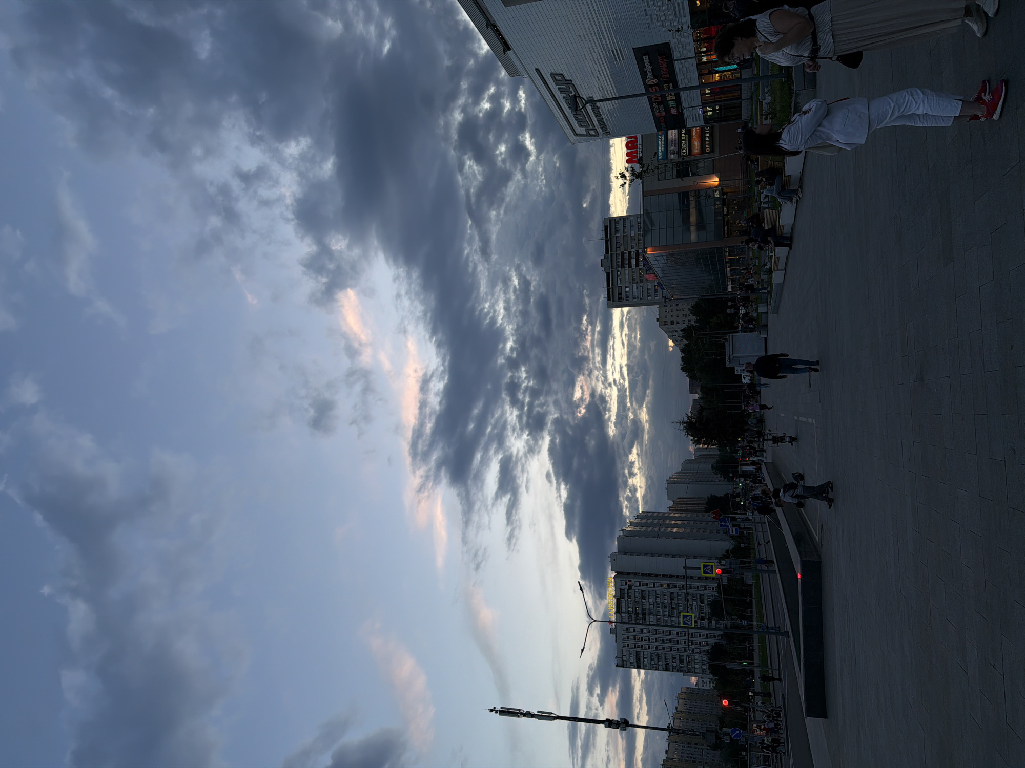 Dramatic cloudy skies observed over Moscow street scene