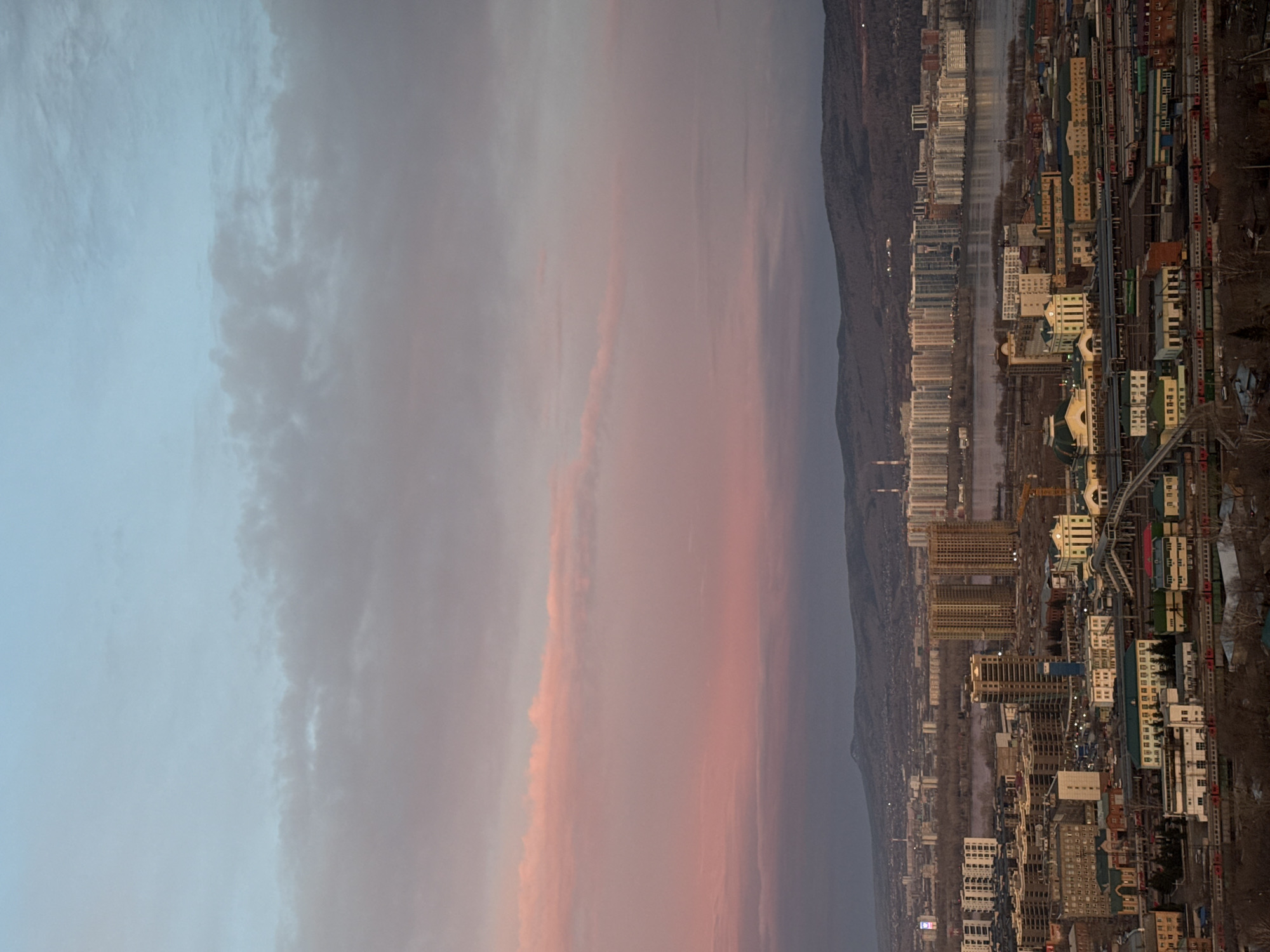 Krasnoyarsk cityscape documented during twilight transition April 27