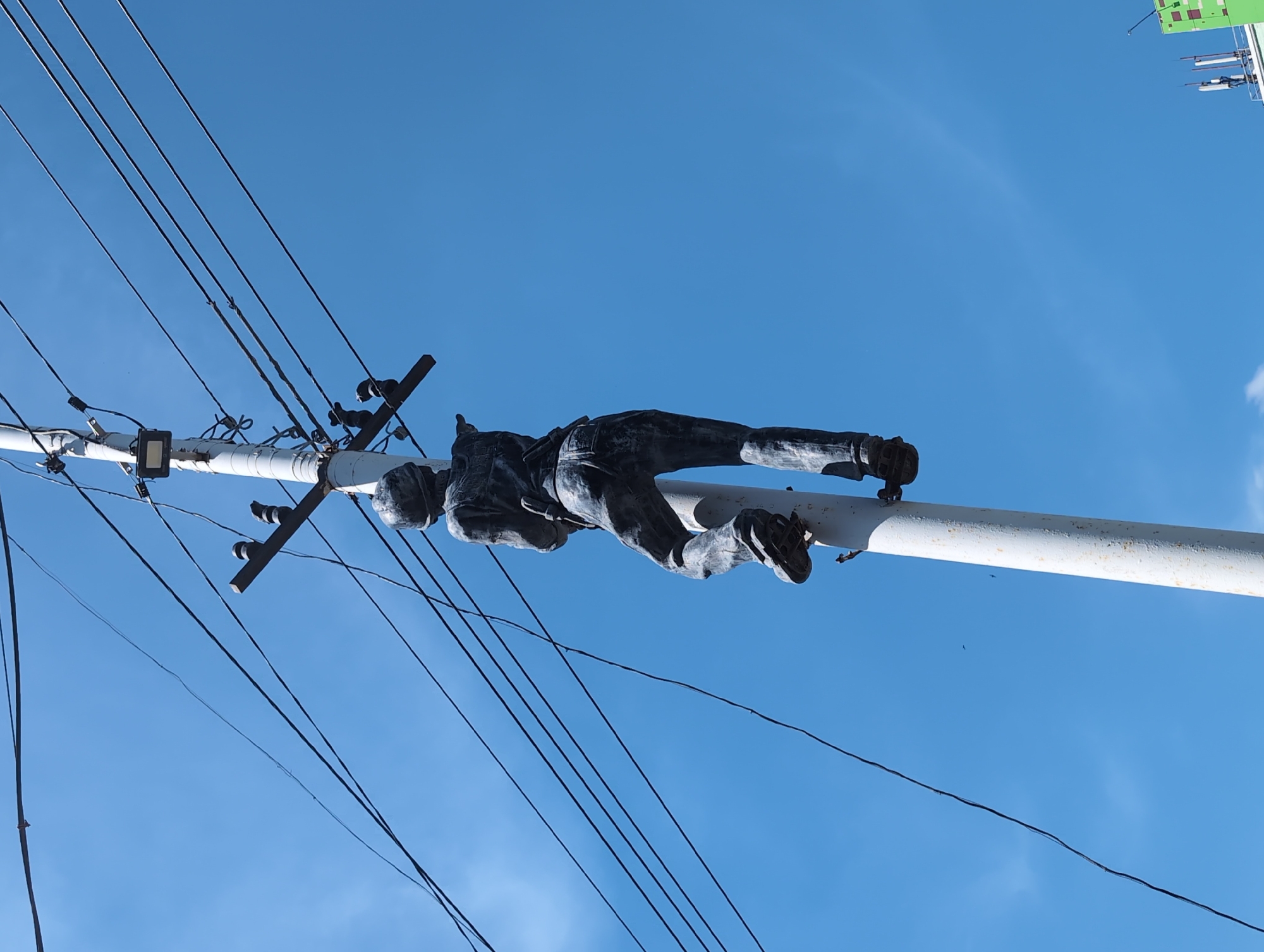 Balancing man sculpture spotted on utility pole in Izhevsk