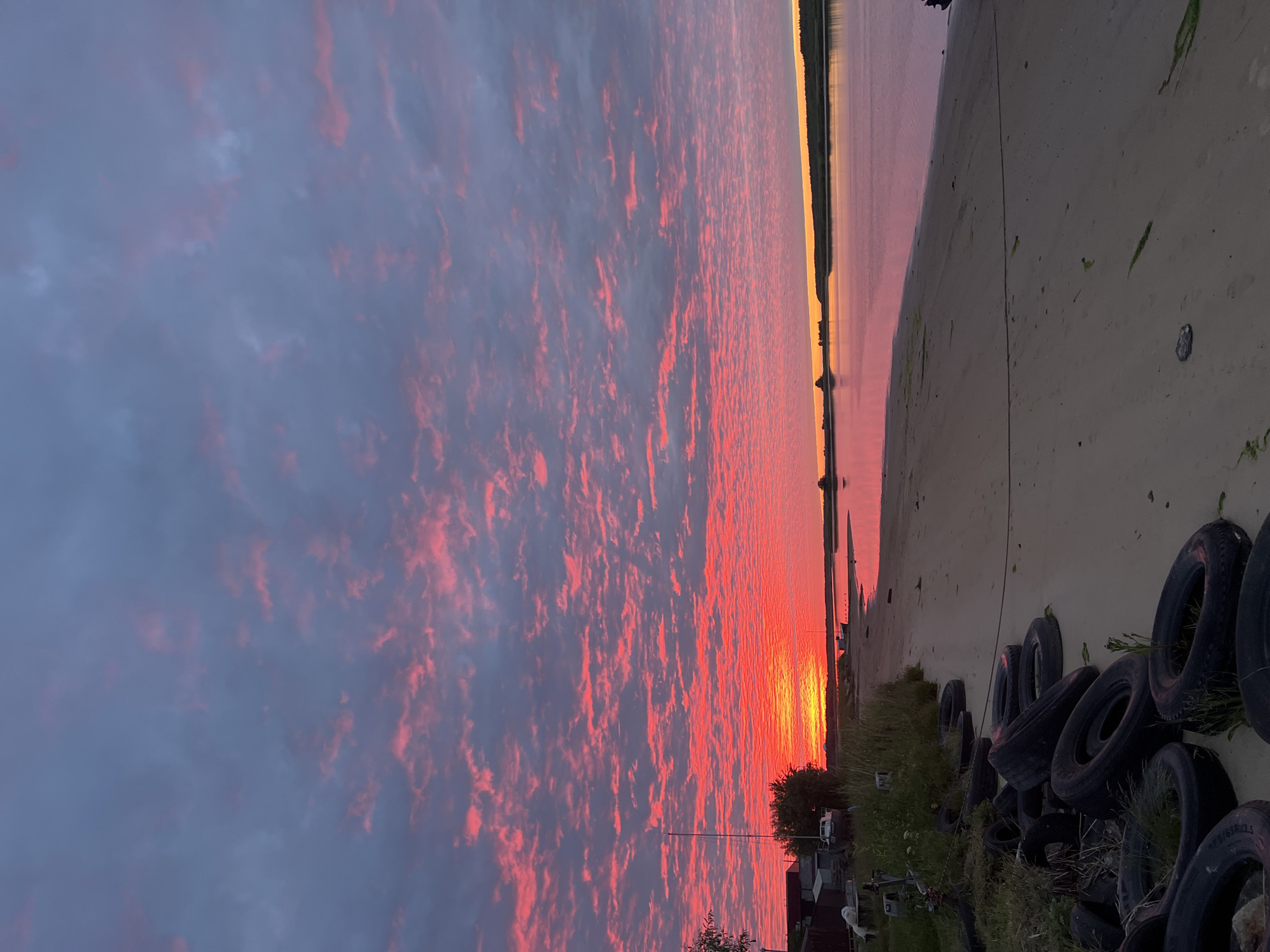 Fiery sunset over Severodvinsk's waterfront, late June evening