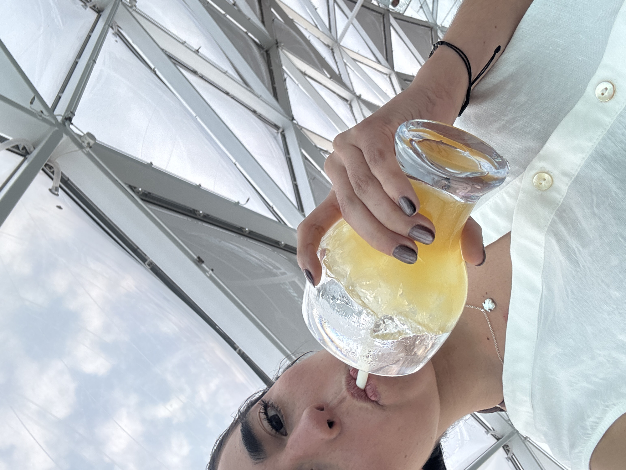 Woman enjoys yellow drink in Cape Canaveral area