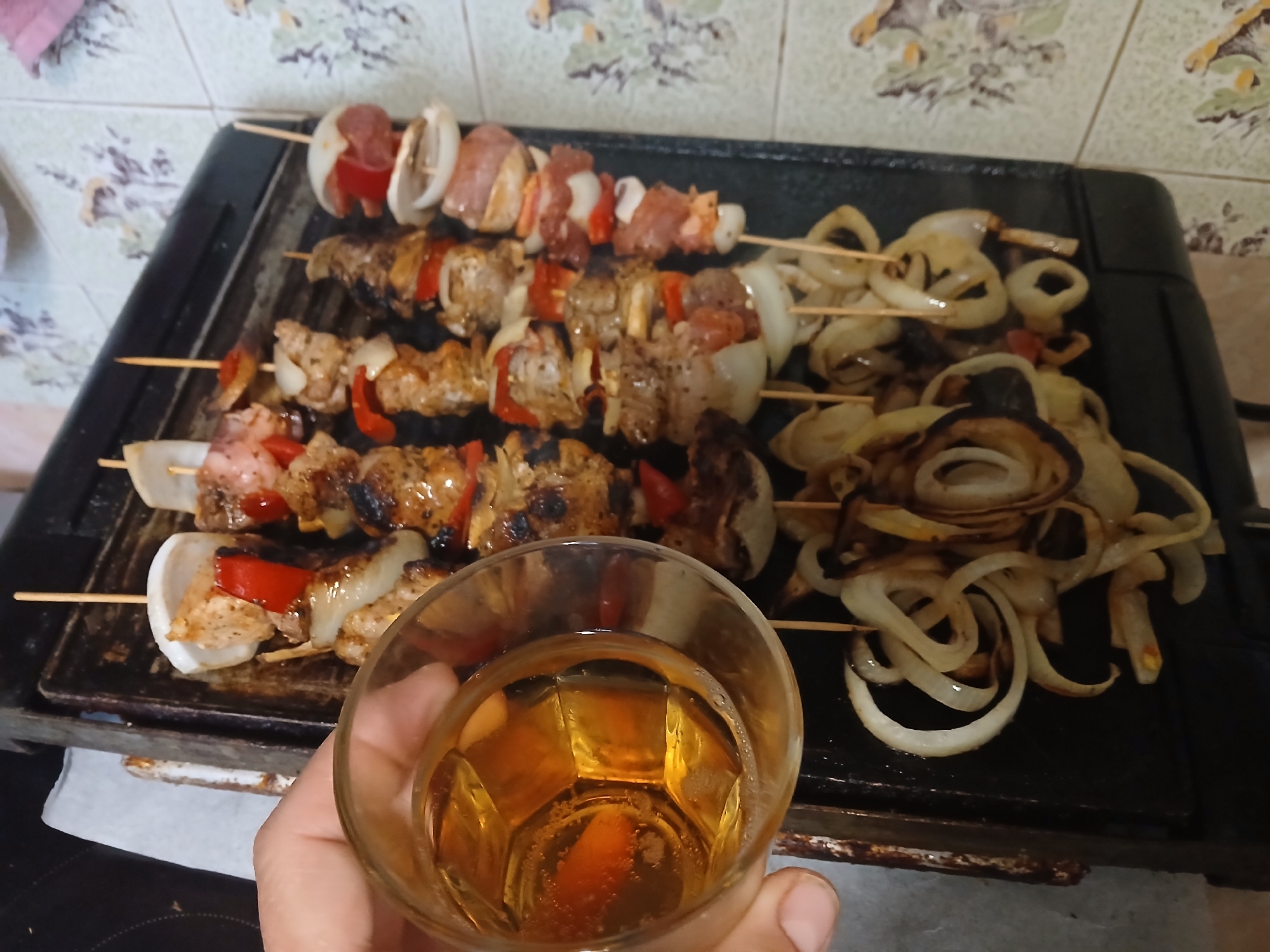 Family barbecue gathering with grilled skewers in Obrochishte, Bulgaria