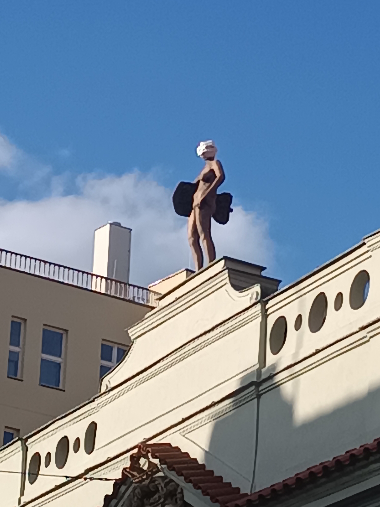Rooftop and facade sculptures along Špálená Street, Prague