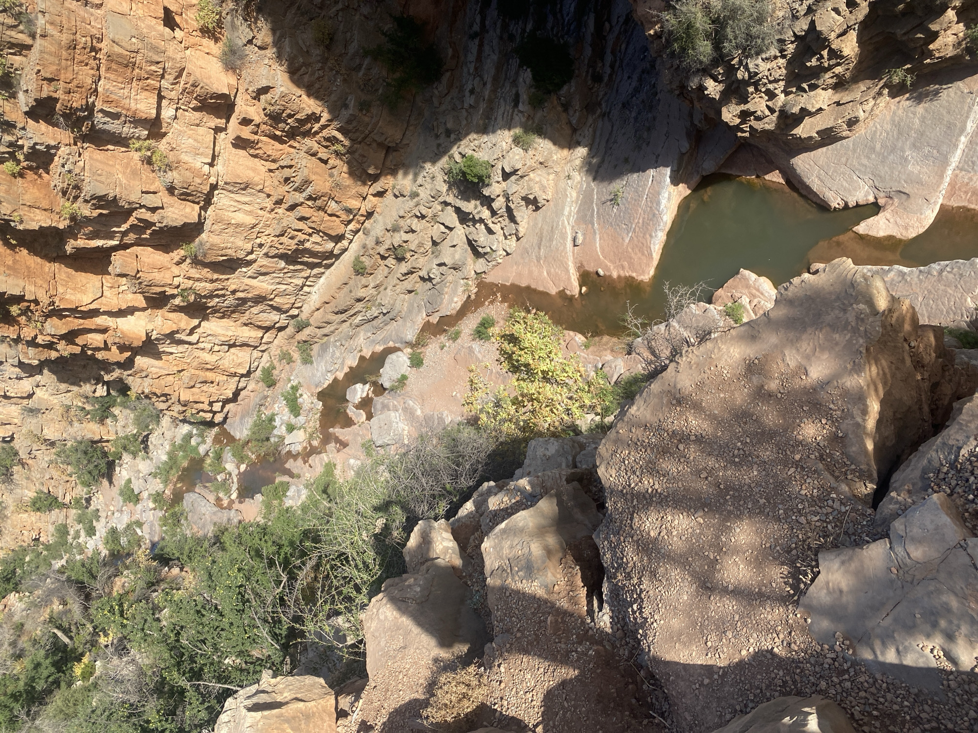 Hiker overlooks canyon gorge near Aqesri, Morocco