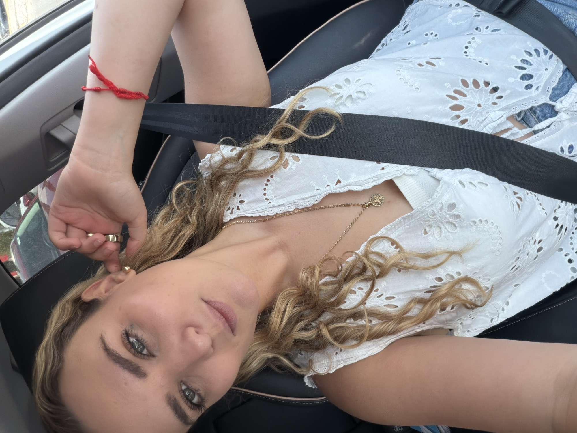Woman takes selfies in car in Tlaxcalancingo, Mexico