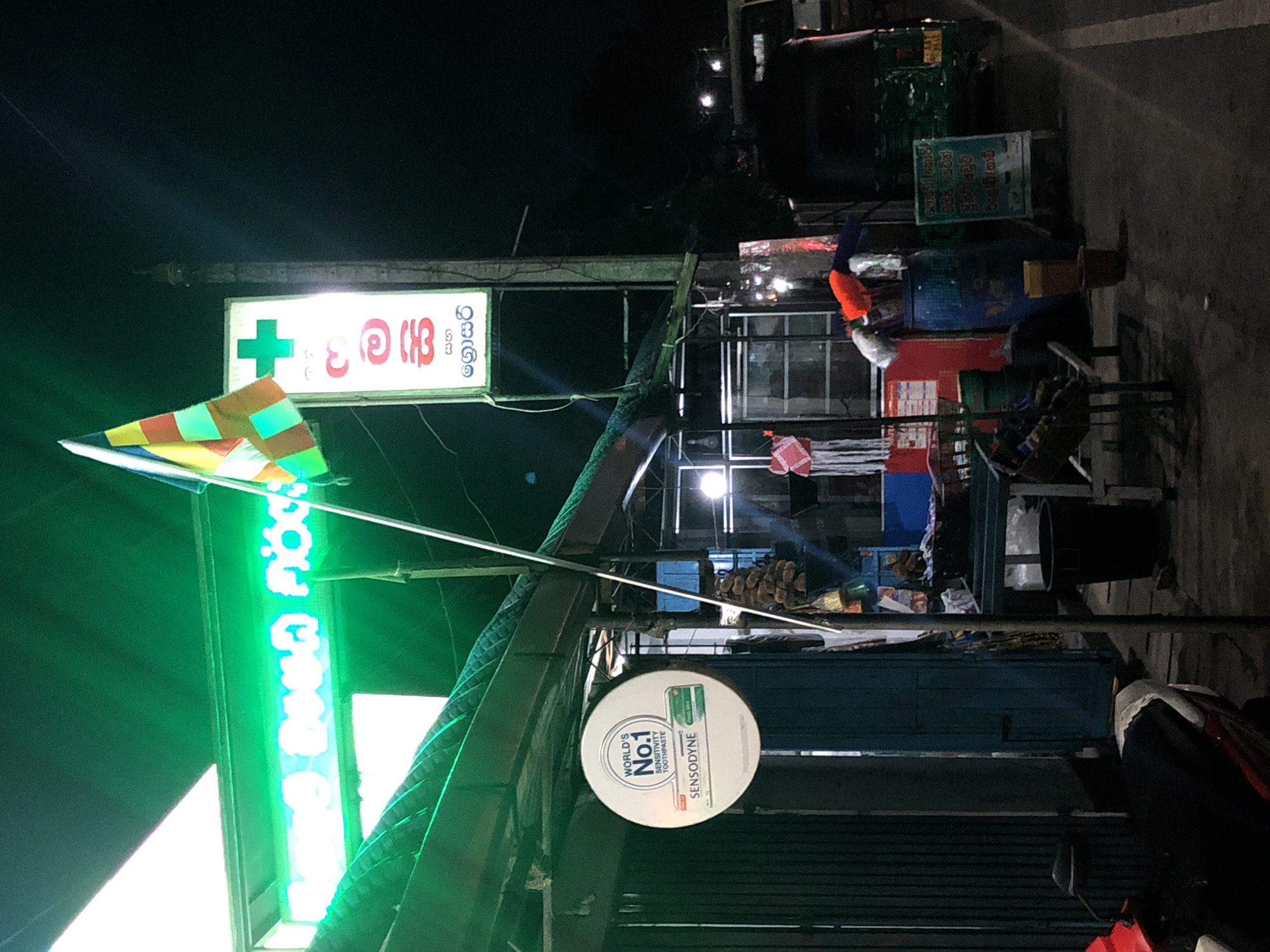 Nighttime commercial scenes captured in two Sri Lankan towns